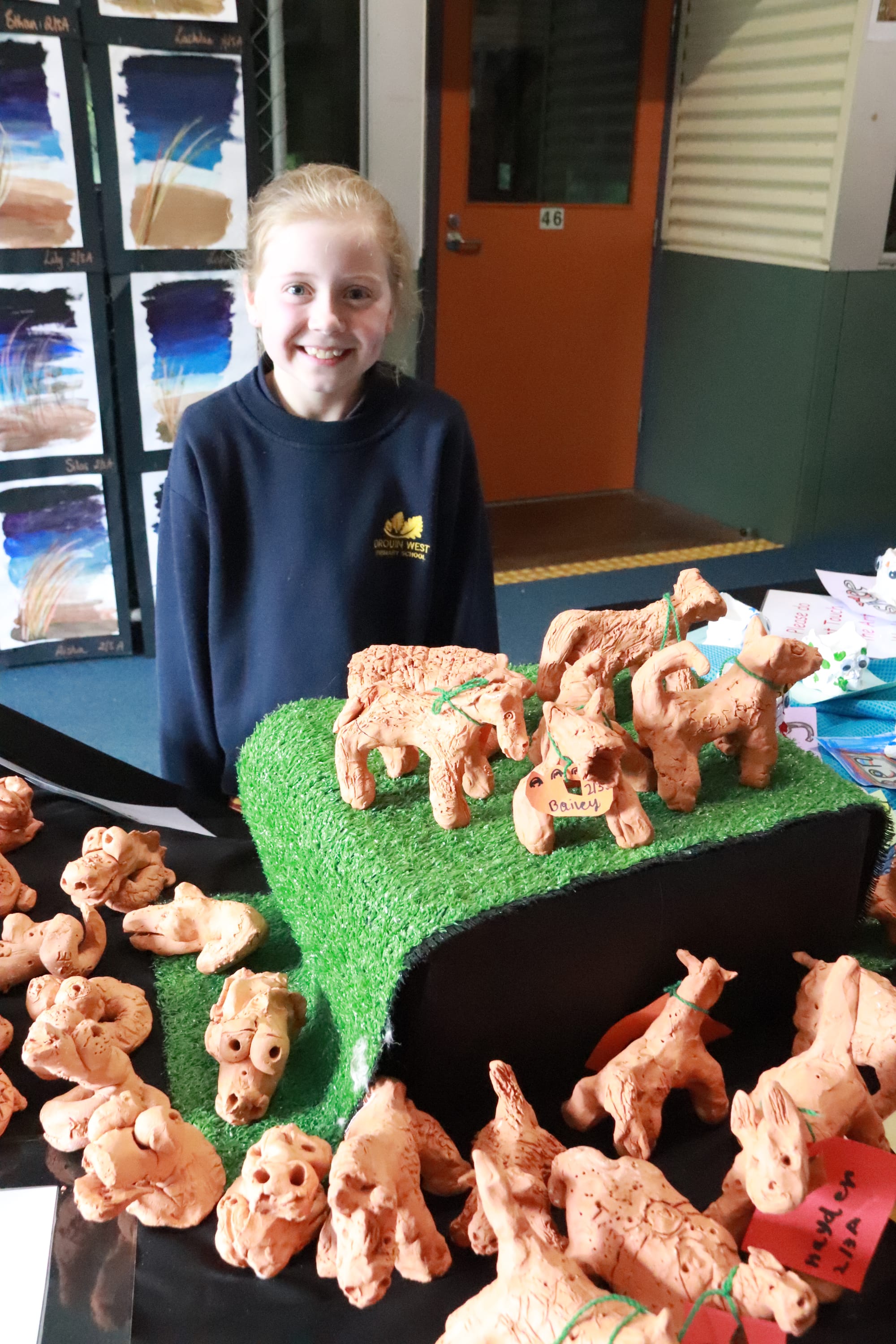 Sienna Gordon looks at the terracotta animals at the Drouin West Primary School art show.