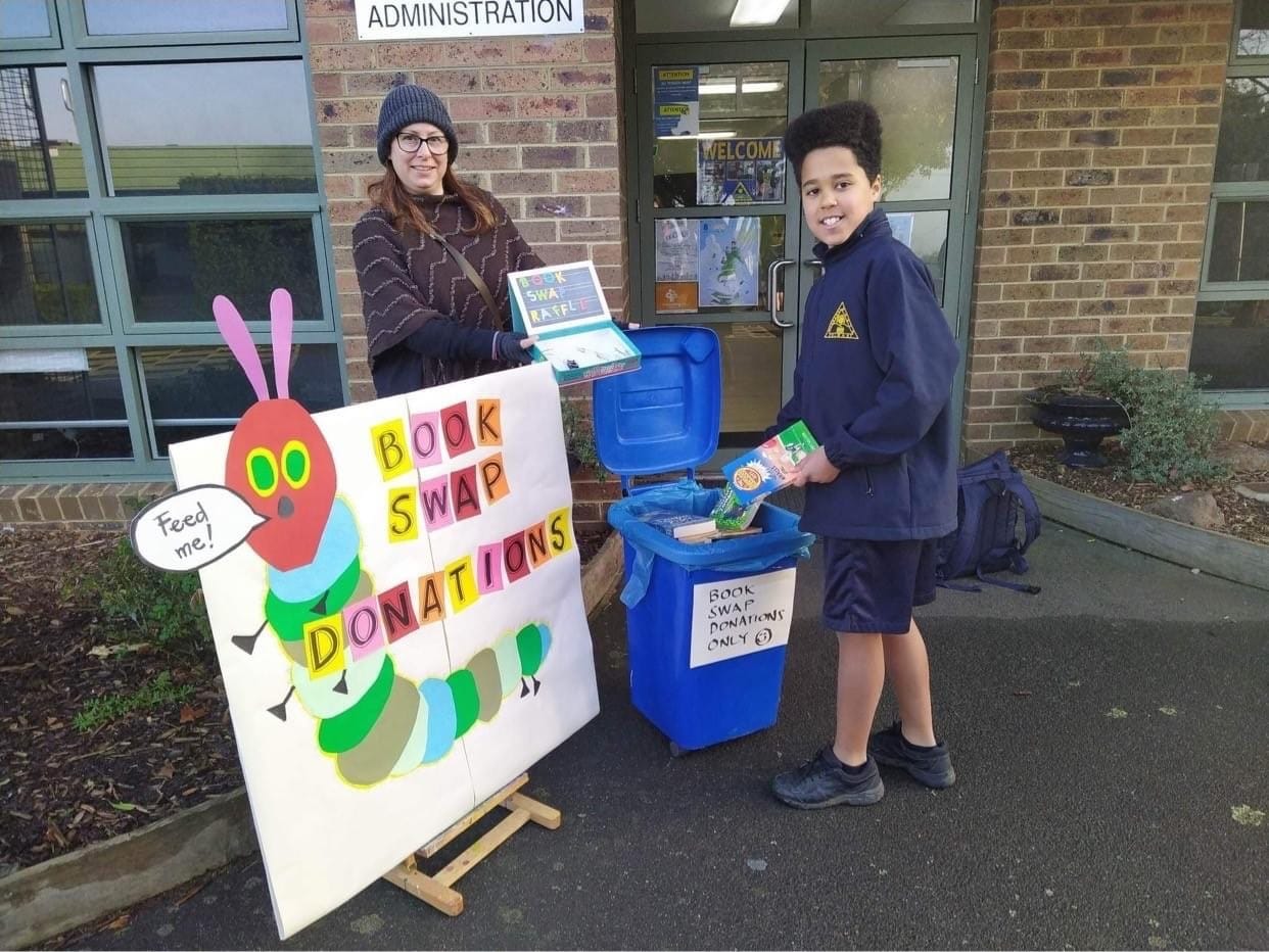 Melanie Turner (parent) and Ezzy at the book swap donation point