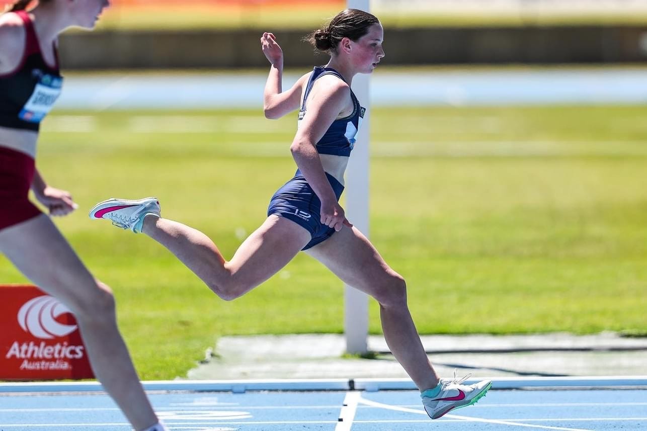 Zaria Dalton crosses the finish line at the Australian All Schools Track and Field Championships.