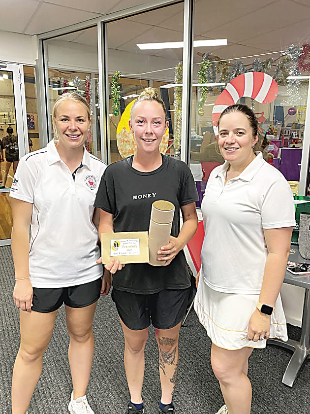 Warragul and District Indoor Netball Netball Association umpires Cassie Armour (left) and Tanya Helliar (right) with the B grade grand final best on court, Tahlia Easton.