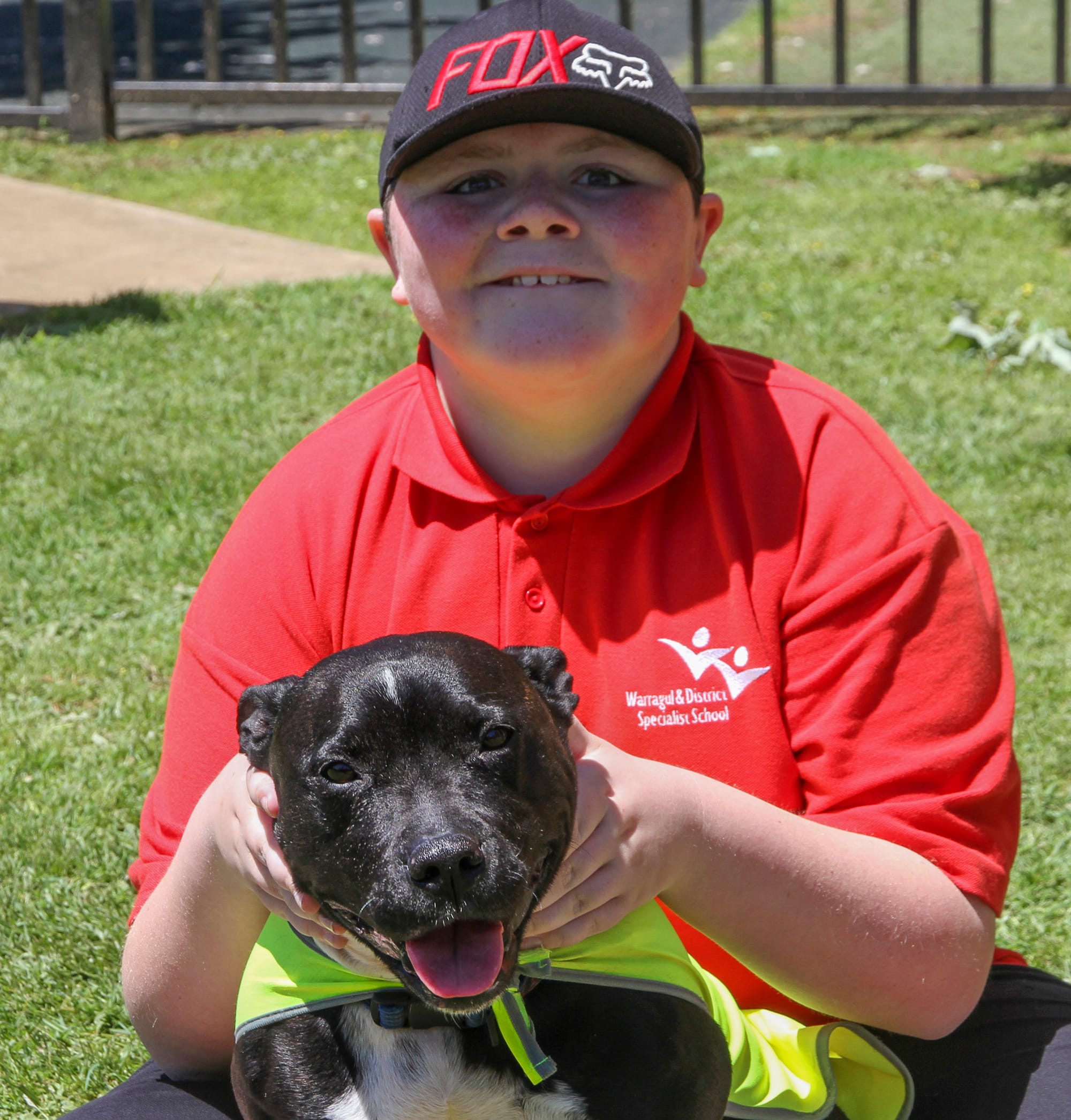 Dominic hangs out with Ajay the dog.