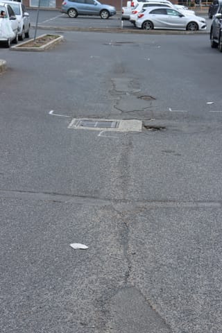 Pot Holes Woolies Carpark - 10.02.2022