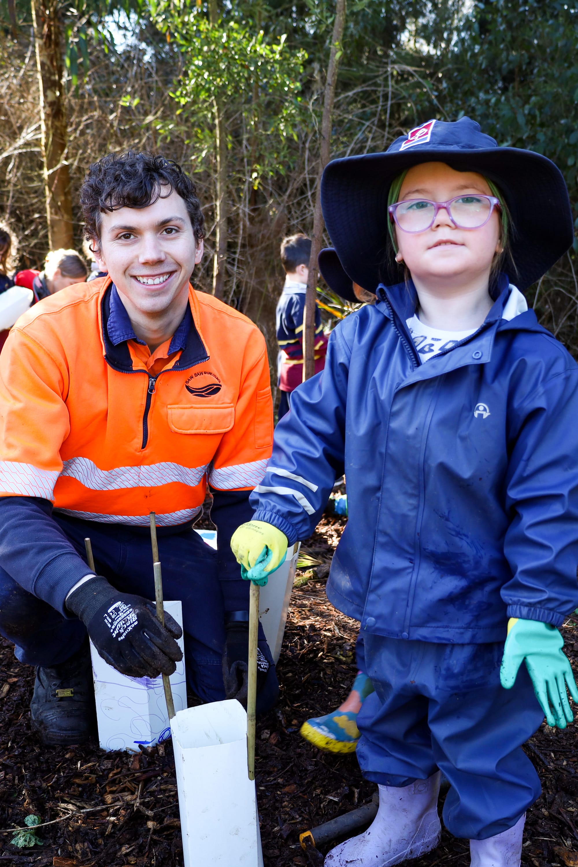 Skylar gets some planting help from Sam from the Baw Baw Shire.