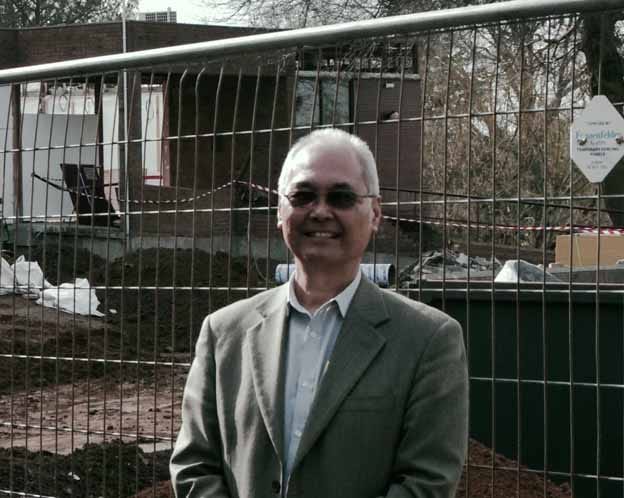 Ian walks away from desk