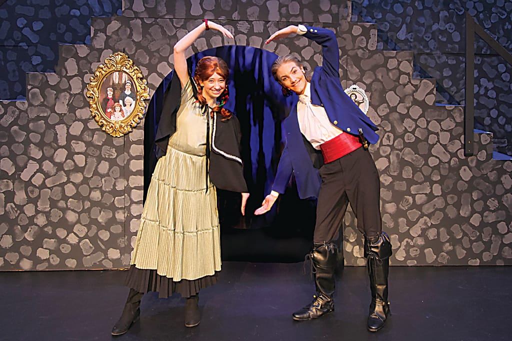 Charmed by his charisma, Anna (Rachel Baker) falls for Prince Hans of the Southern Isles (Amon Calabro).