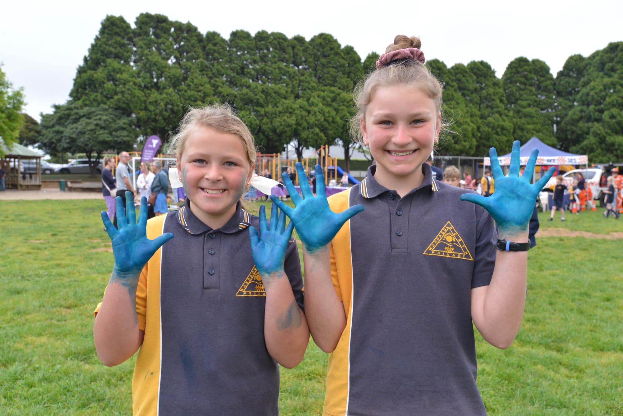 Happy with their new smurf look after taking part in spray art fun are sisters Mia (left) and Ava Lennox.