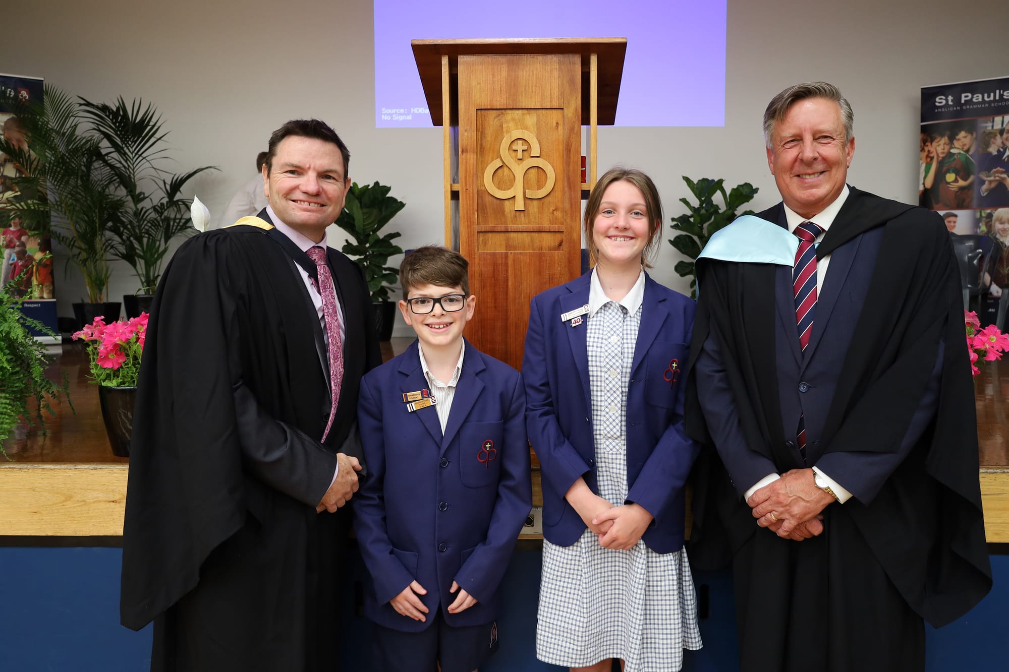 St Paul's Warragul Junior School captains Luke Blackwood and Anneke Beamish with Head of Warragul Junior School Rowan van Raay (left) and principal Cameron Herbert (right).