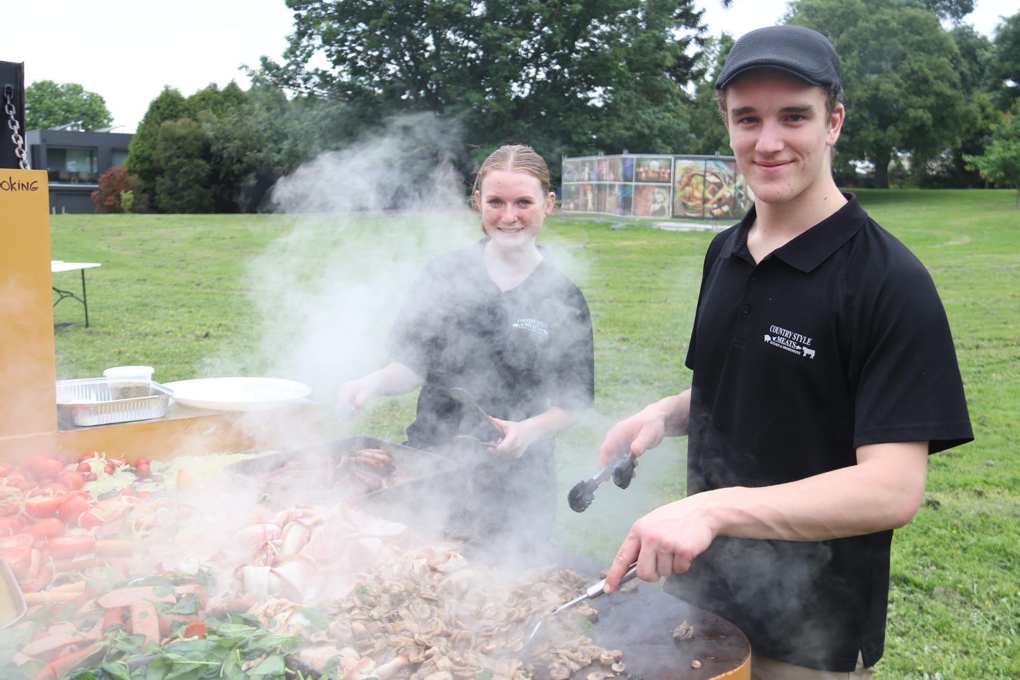 Helping out on the barbecue are Mikayla Kidley of Garfield and Ethan Wood of Bunyip.