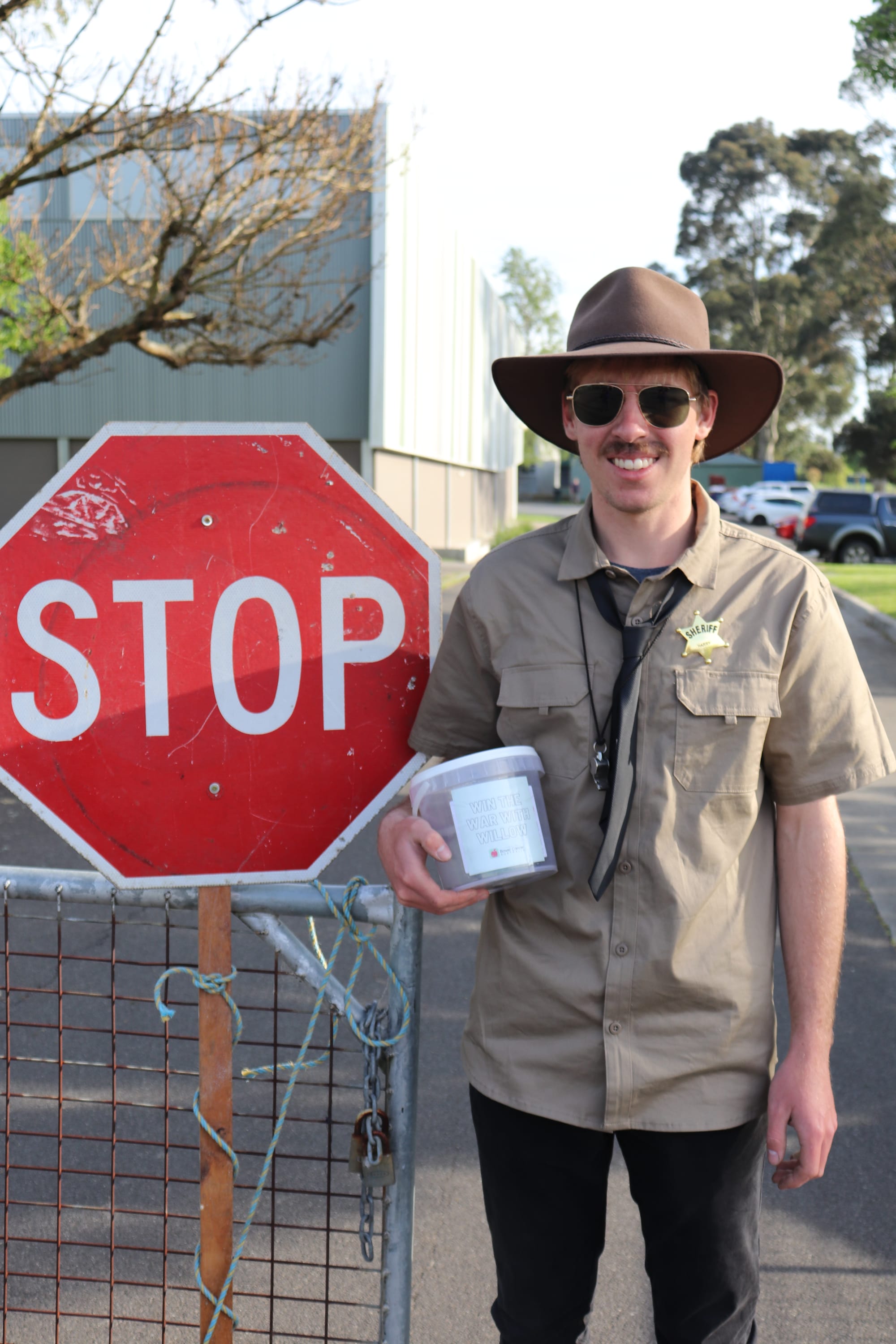 Year 12 students took turns staffing the school driveways on celebration day, making the teachers pay to park on site. On duty is Harry Pace.