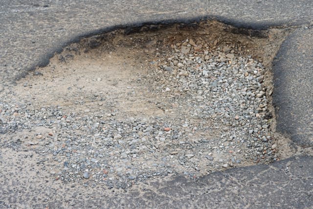 Pot Holes Woolies Carpark - 10.02.2022