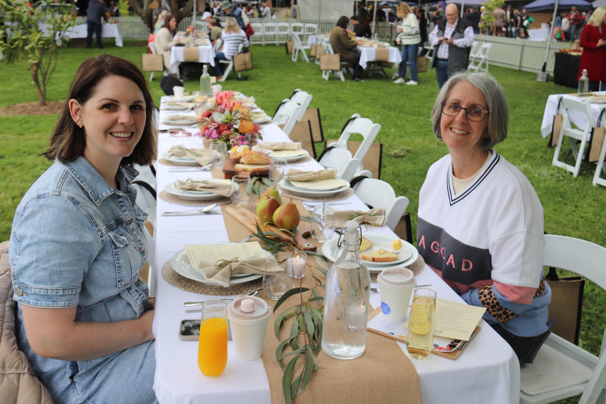 Ashlee Moore and Michelle Richmond of Newborough enjoy a brunch in the park on Saturday.