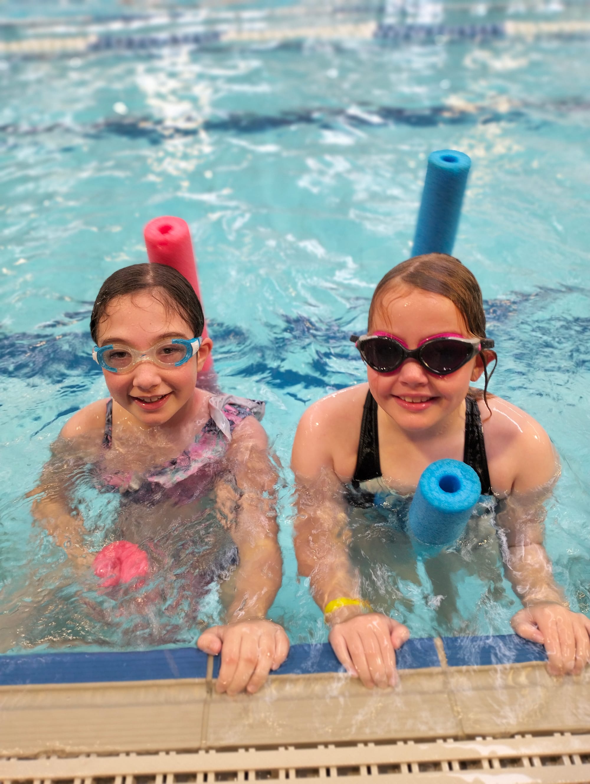 Enjoying their time in the pool are Esmaee Gonzalez and Camille Hanley.