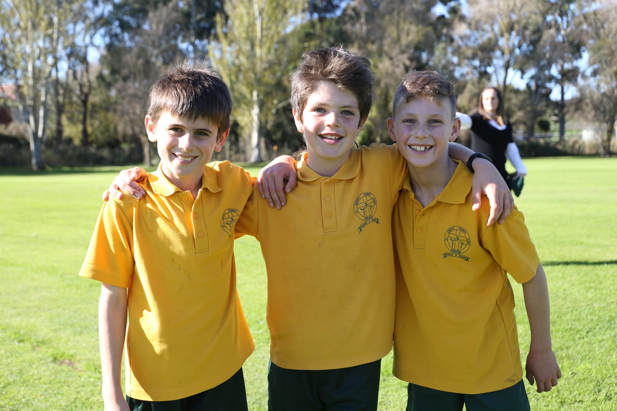 All smiles after top three places in the St Joseph's Primary School cross country for eight to 10-year-old boys are (from left) Josh, Lenny and Zac.