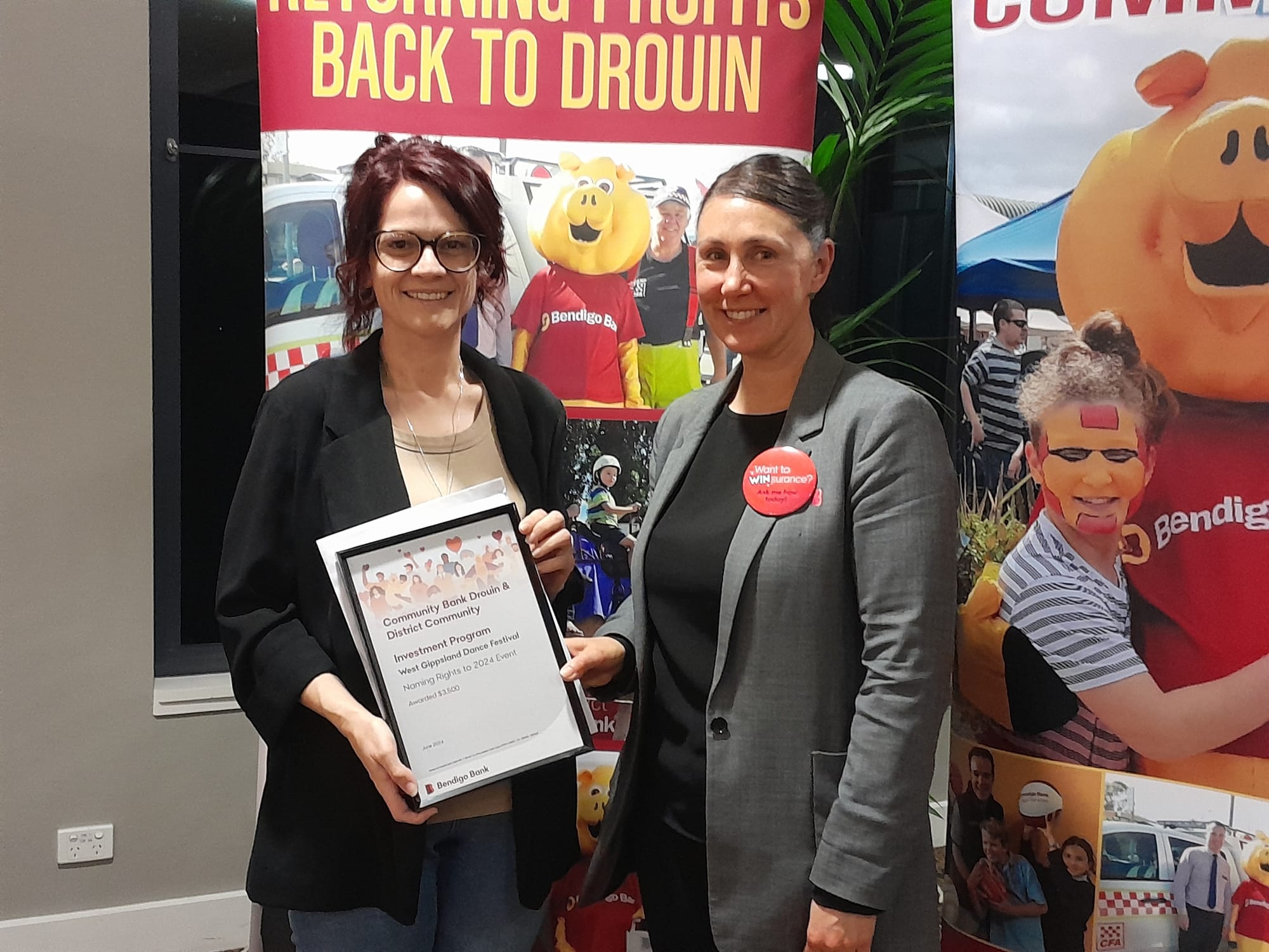 West Gippsland Dance Festival representative Janelle Armstrong receives funding from customer service officer Jade Dance.