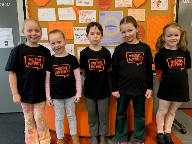 One of the school parents made t-shirts to spread the stop bullying message. Proudly wearing their t-shirts are (from left) Pippa, Sophie, Nyah, Sienna and Addi.