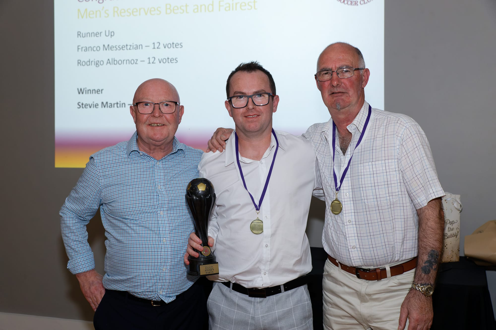Reserves best and fairest Steve Martin (centre) and coaches Alex Martin and Ian Wallace.