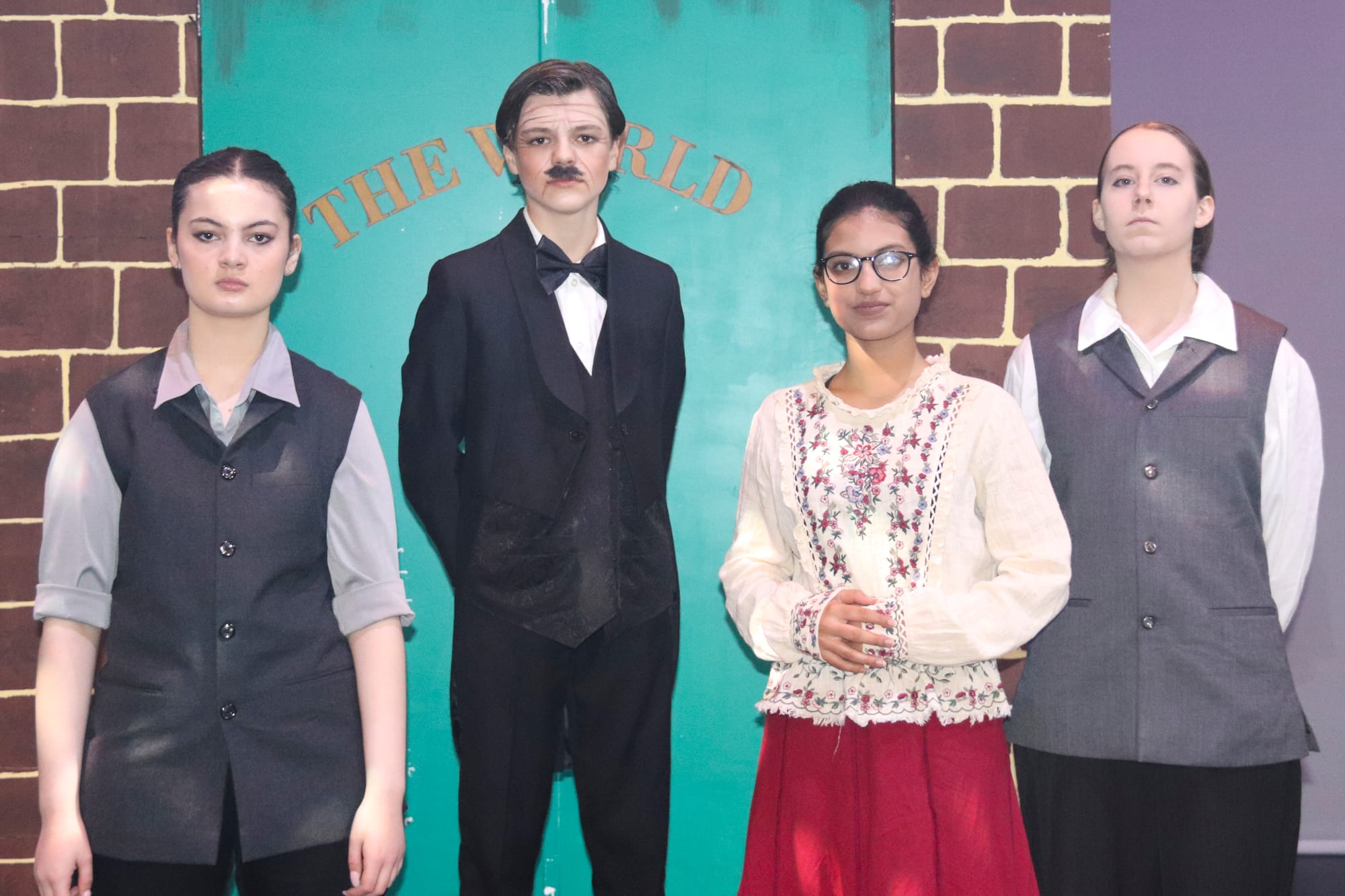 Determined to keep the newsies in line, Seitz (Sienna Hodder), Joseph Pulitzer (Ruben Nelson), Hannah (Deena Ahmed) and Bunsen (Lucinda Reeves) remain stern.