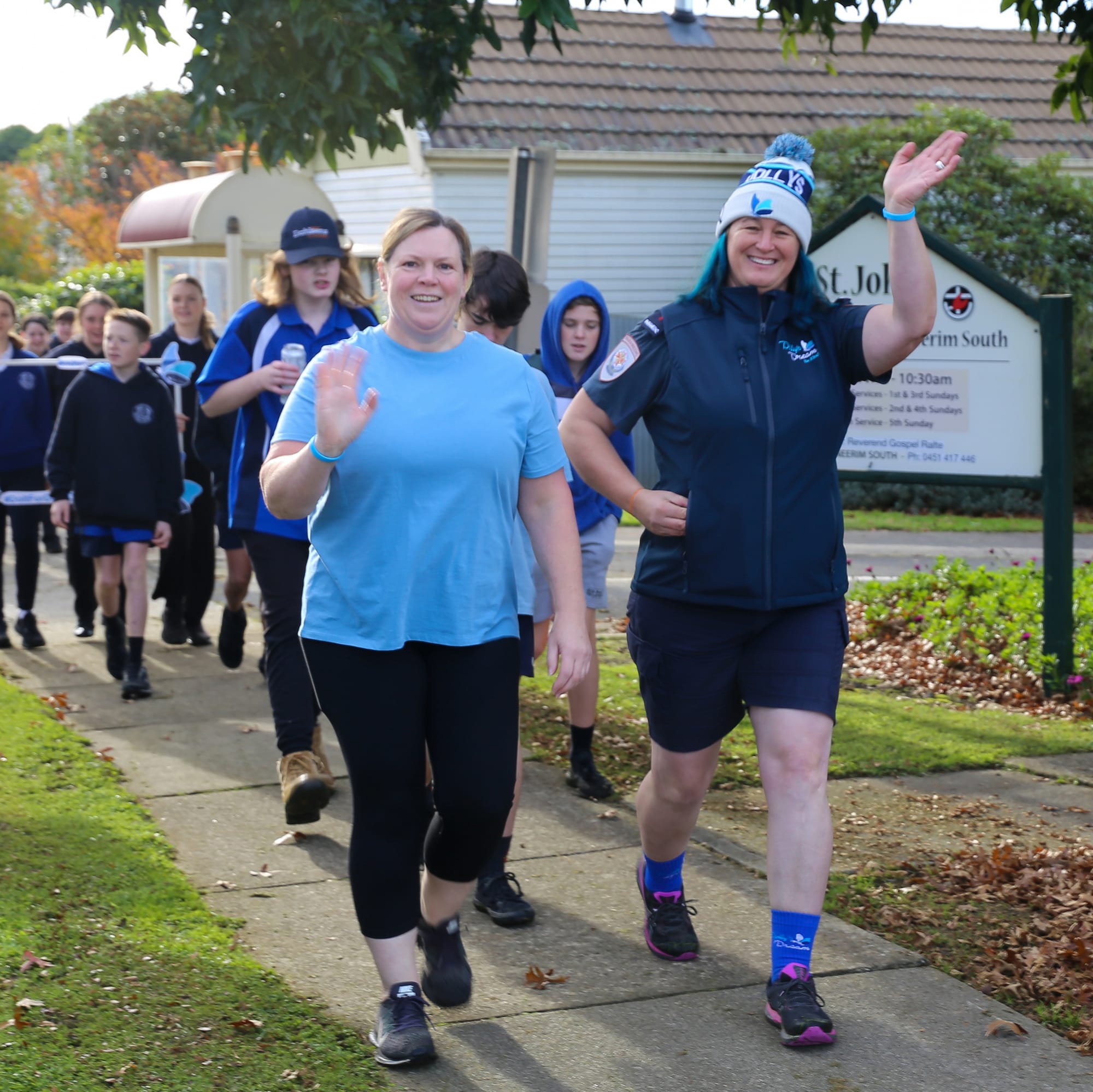Paramedics Sian Clarke and Trish Tomlin walk with Neerim South students.