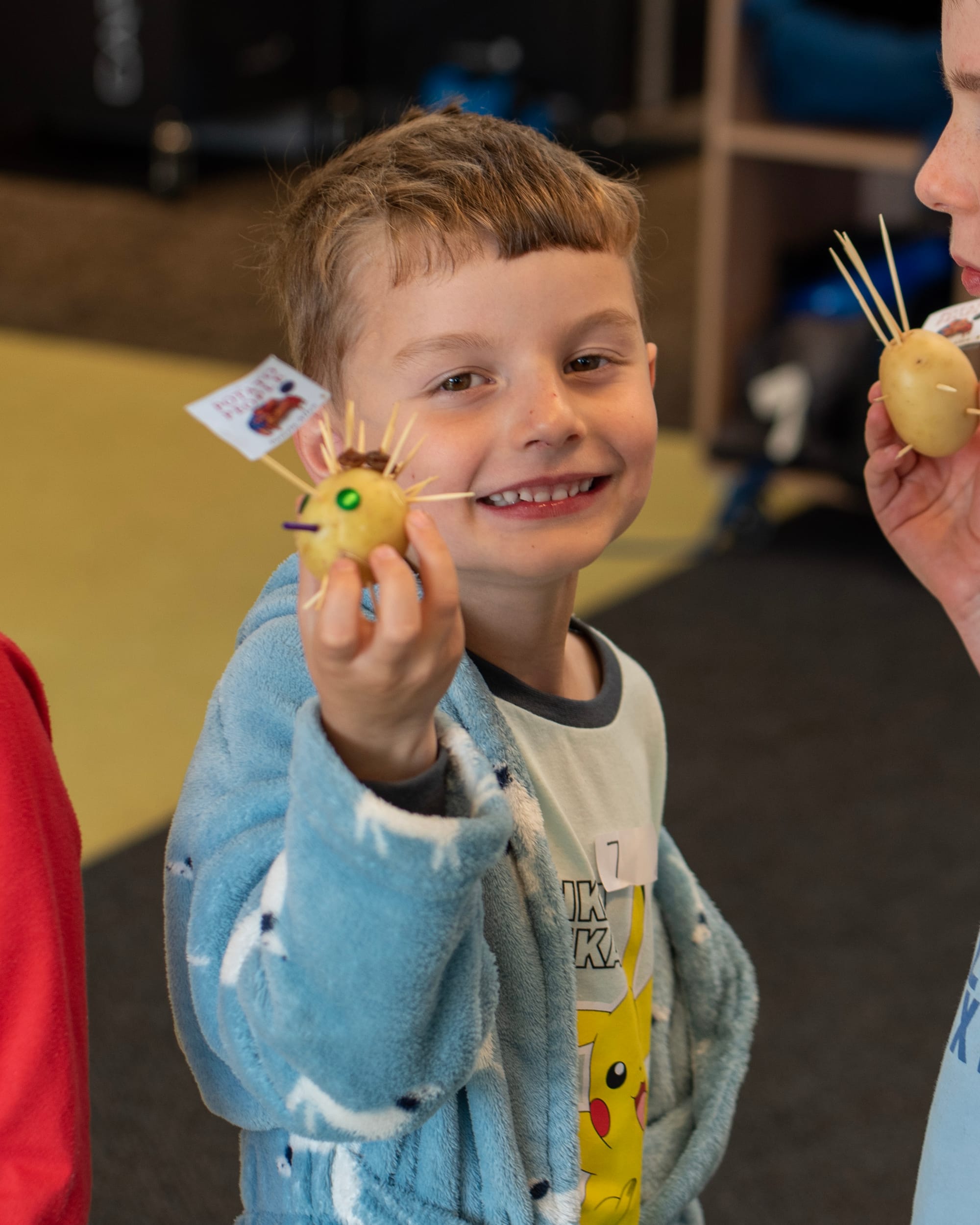 Bill Gunn presents his potato person after reading the book Potato People.