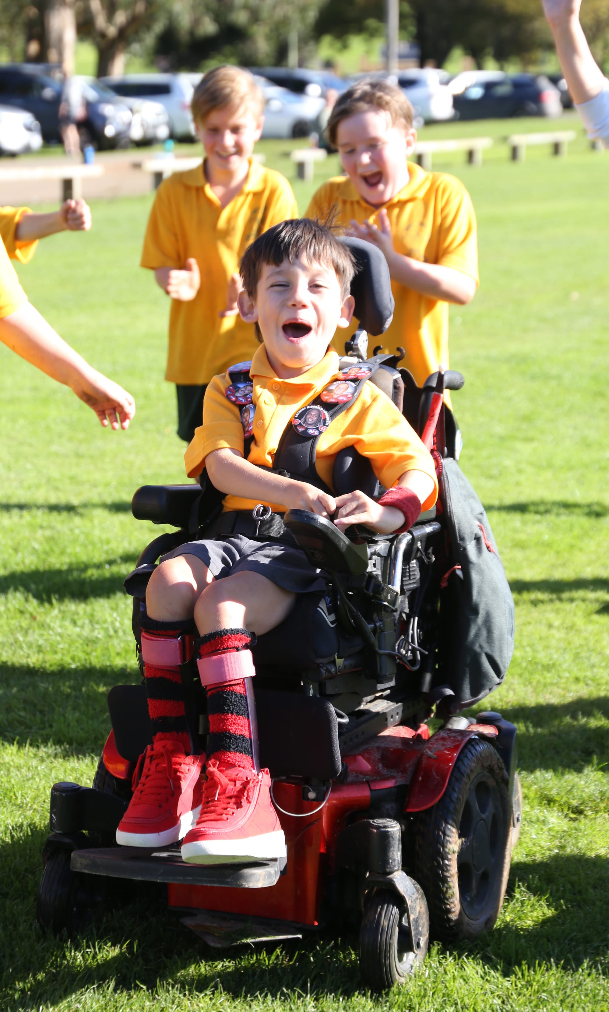 Karter celebrates after crossing the finish line of the 2km cross country course with his mates.