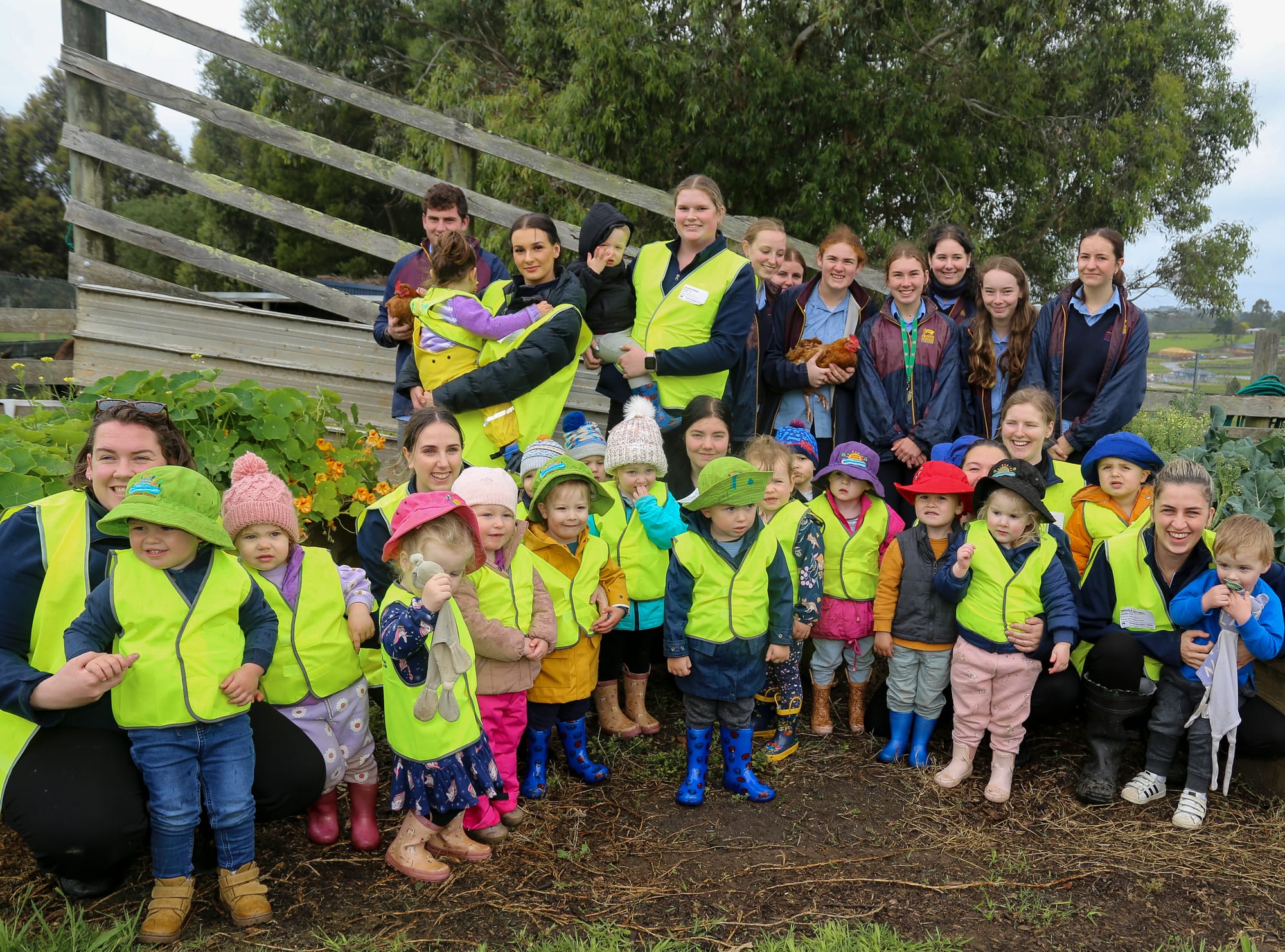 Little Saints with students from Drouin Secondary College's agriculture program.