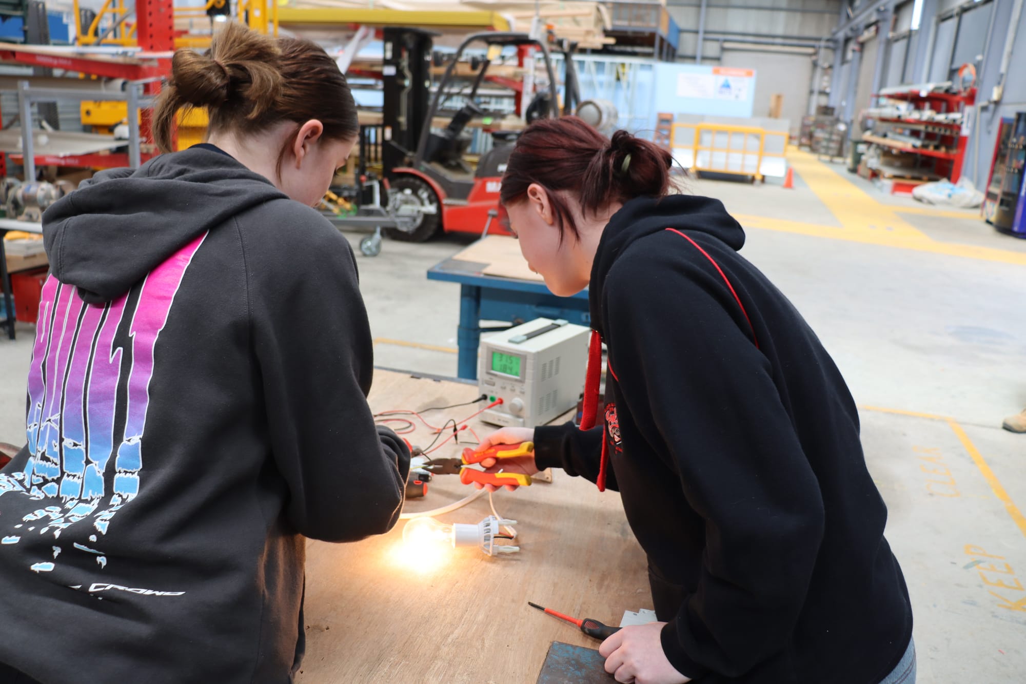 Students working with an electrical circuit
