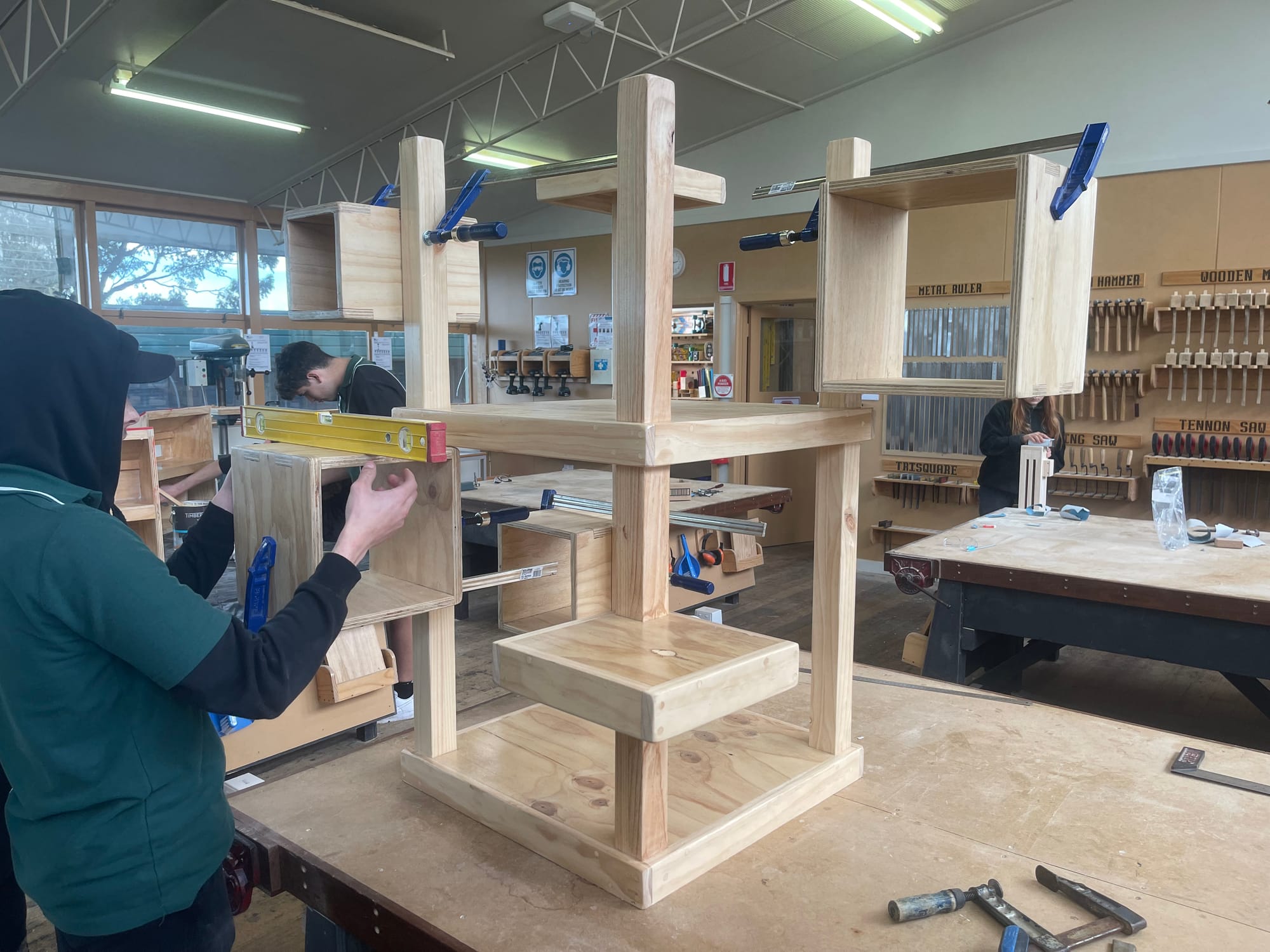 Napoleon Romagnino, Zach Thompson and Alexis Rossi (obscured) work on the kindergarten project.