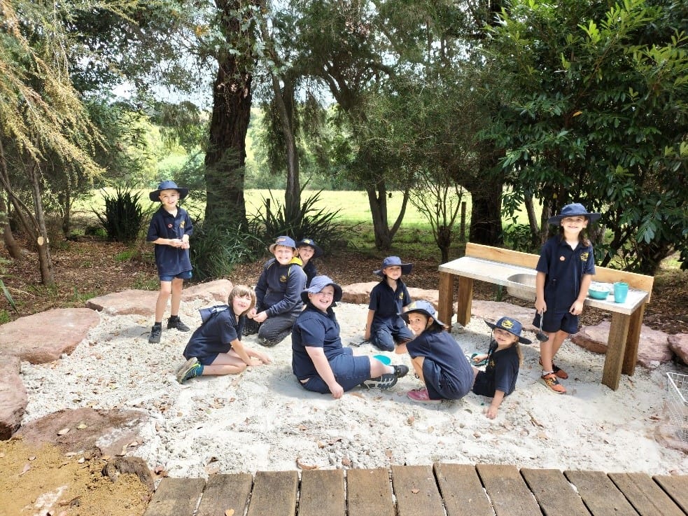 Zayne Oldham, Max Foley, Samuel Sheil, Kelly Rippon, Xavier Donnelly, Max Mitchell, Willow Gonzalez, Madi Ashby and Tate Oldham enjoy the new sandpit in the bushland setting.