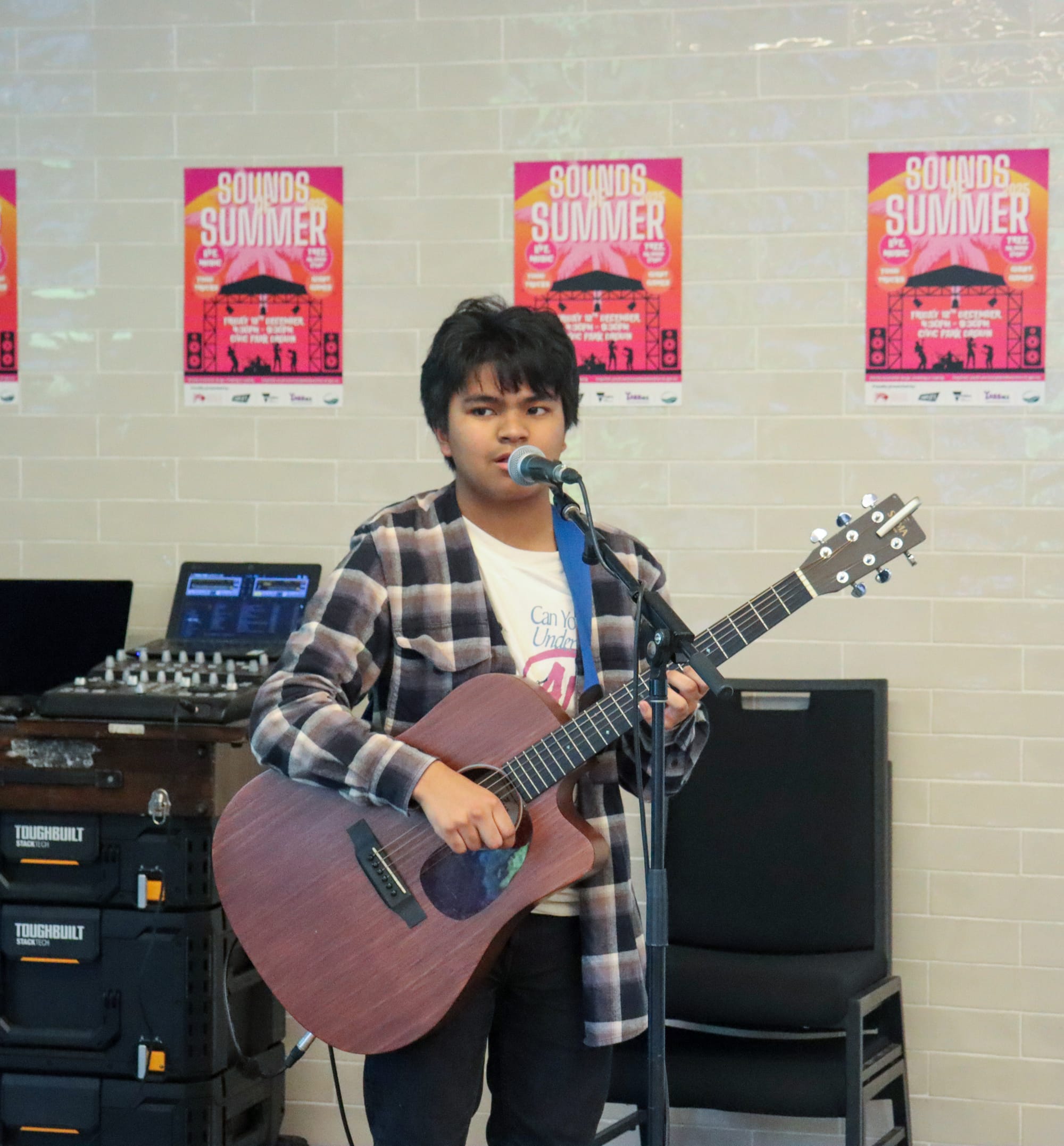 Young musician from Drouin Secondary College, Daniel Andrews, performed to a crowd in the foyer.