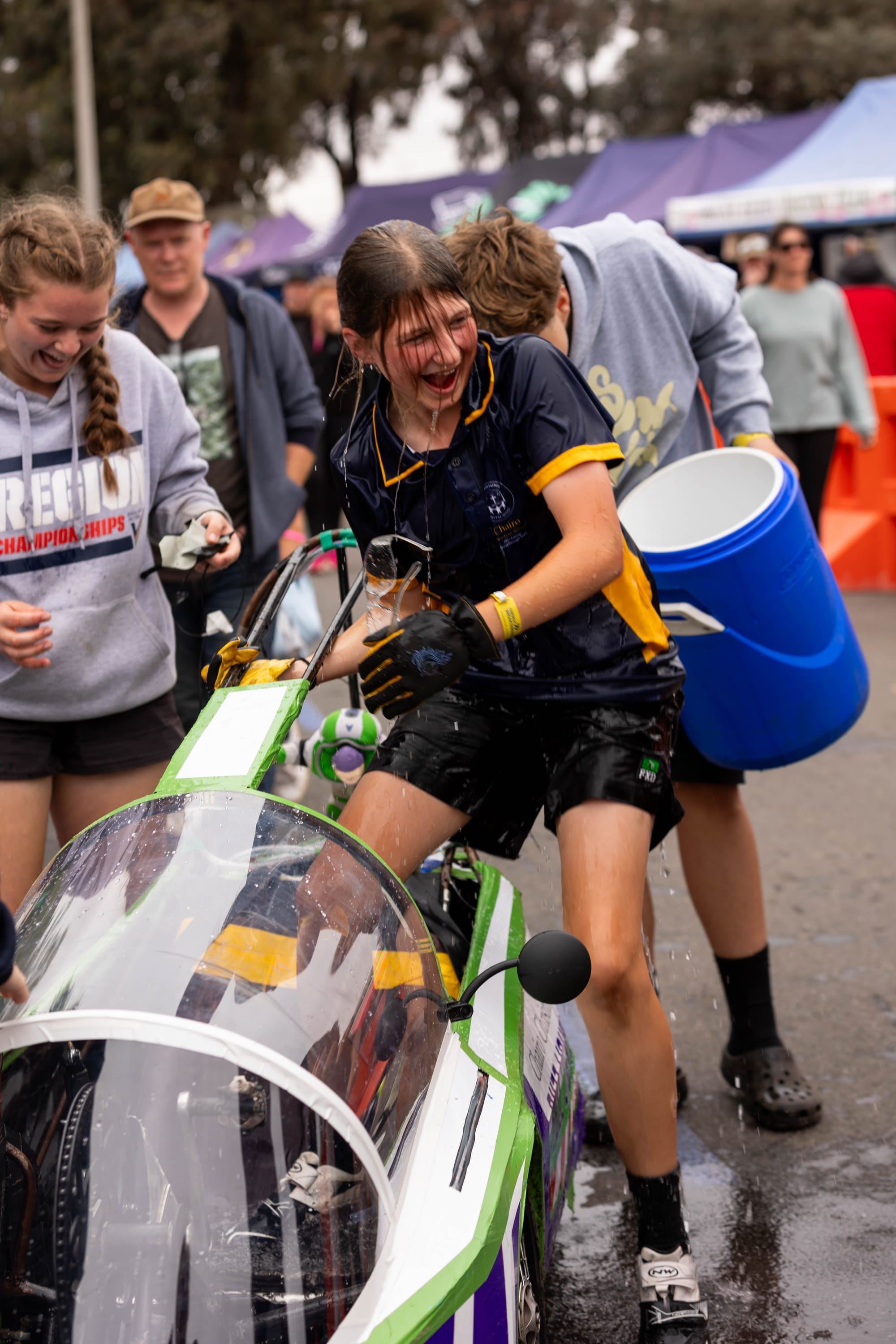 Chairo Christian School year 8 student Violet Dodd gets the traditional cold water drenching as the final driver for her team in the Energy Breakthrough.