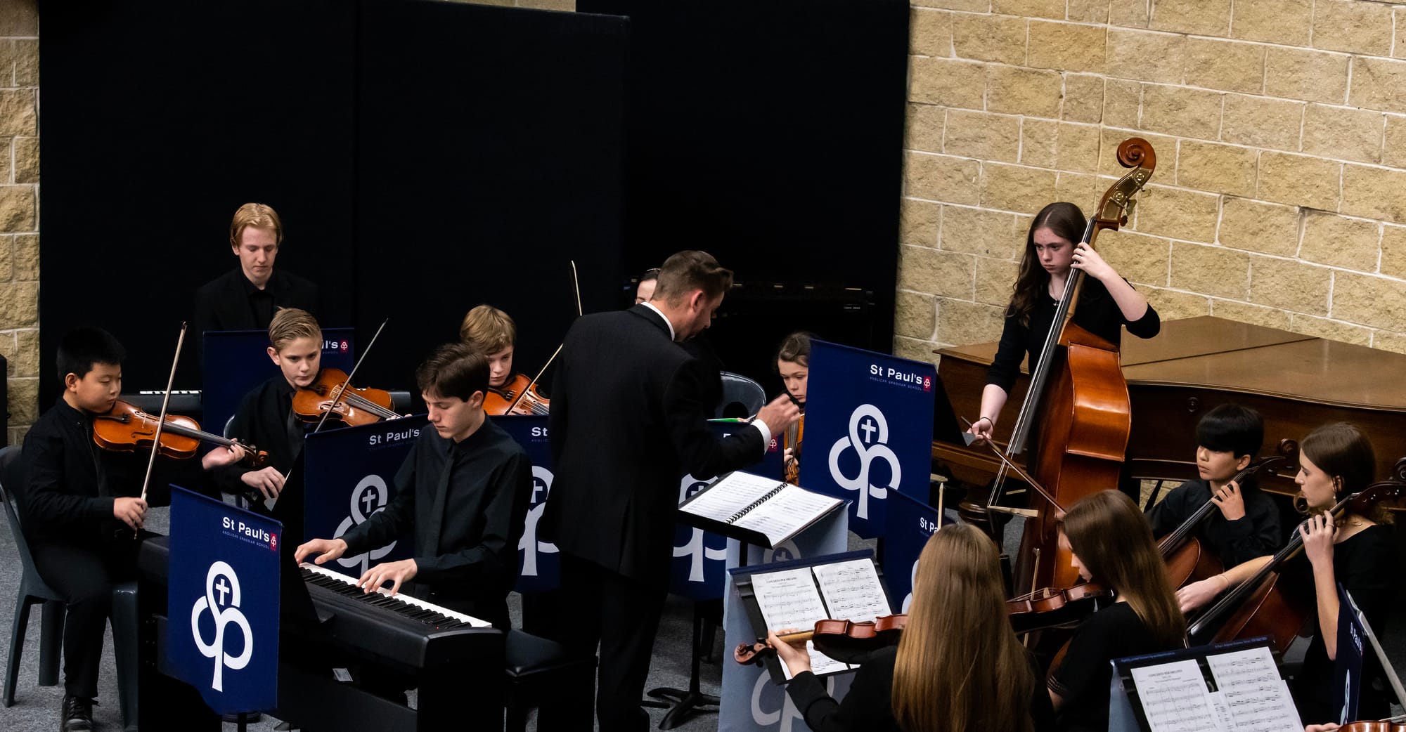 The organ and chamber orchestra being conducted by Mr Ben Sim, head of St Pauls Academy of Music.