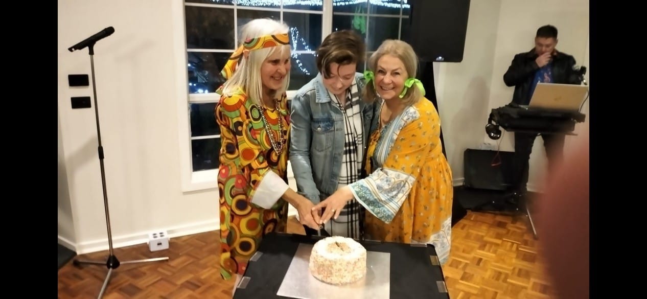 Cutting the 21st birthday cake are Baw Baw Food Relief manager Anne Pascoe, volunteer Gemma Bourke and co-ordinator Jan Davidson.
