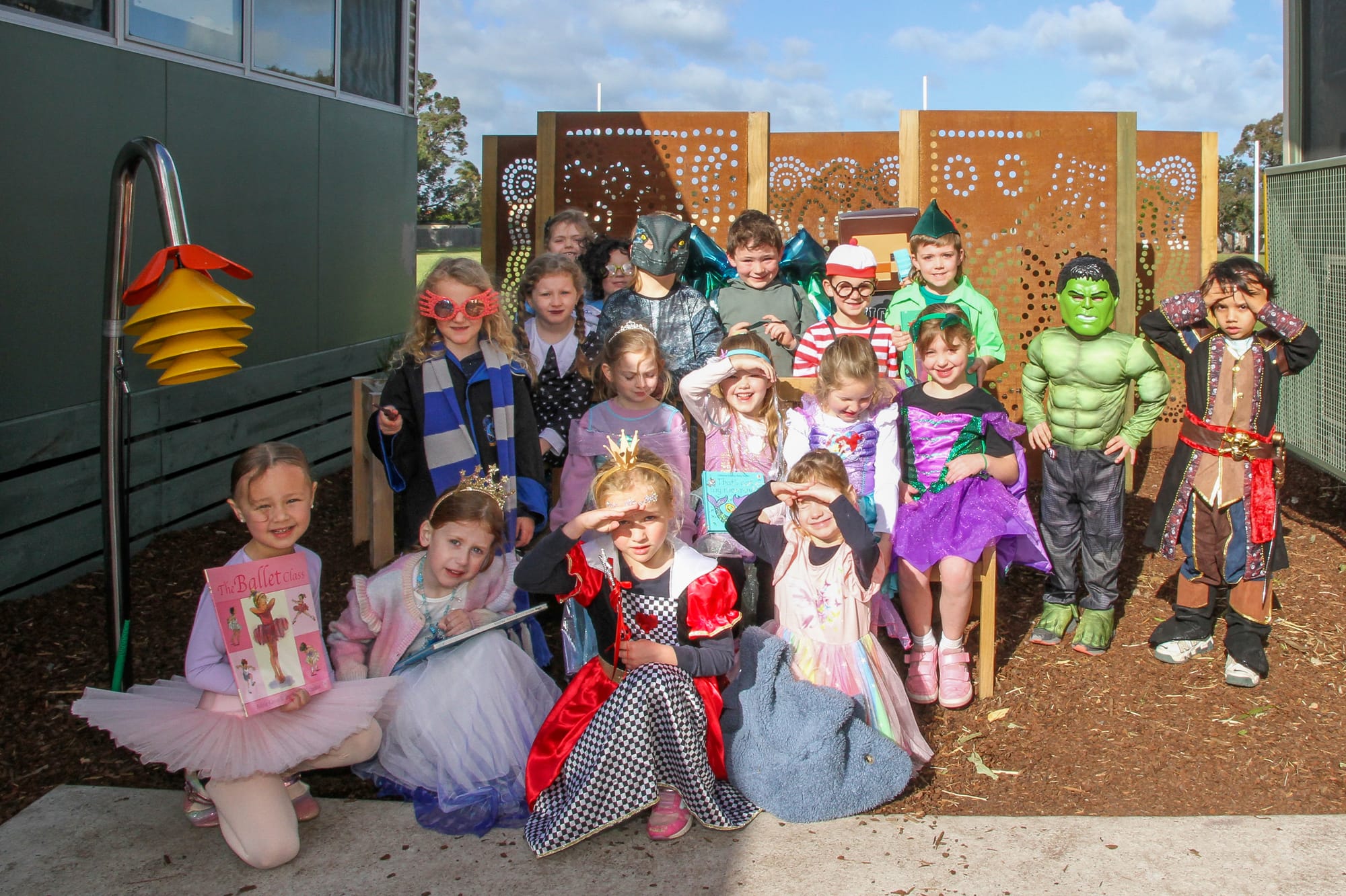Zahli May-Curtis, Marley Kerr and Xanda Mook take a front row seat in the new Indigenous garden officially opened on August 30.