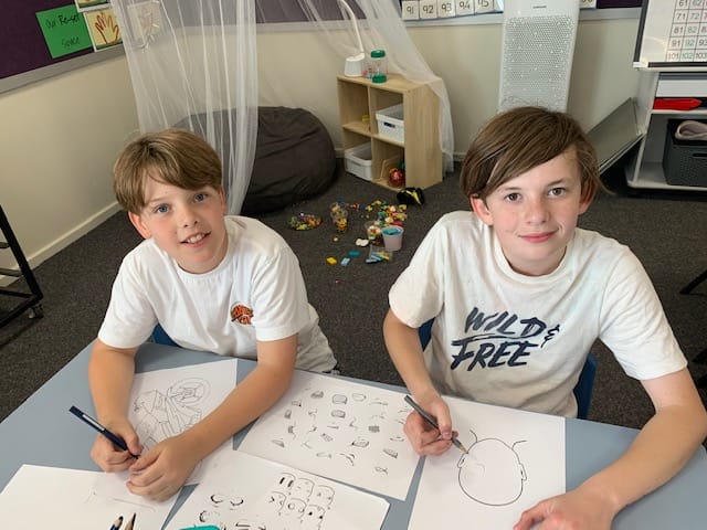 Senior students enjoying manga drawing, from left, Billy Deppeler and Noah Plozza.