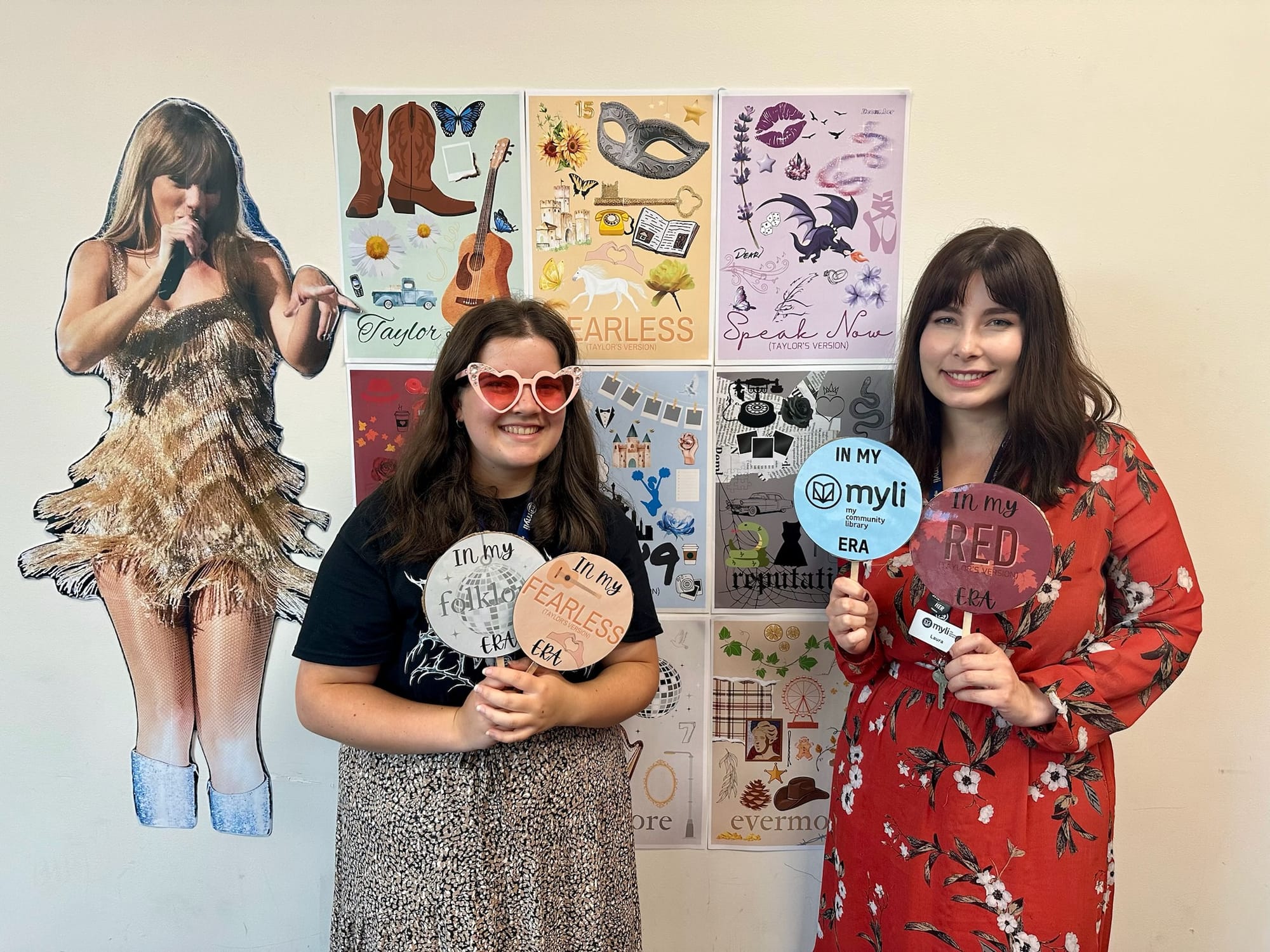 Posing in front of the photo wall Myli team members Hannah and Laura showed off their Swiftie spirit.