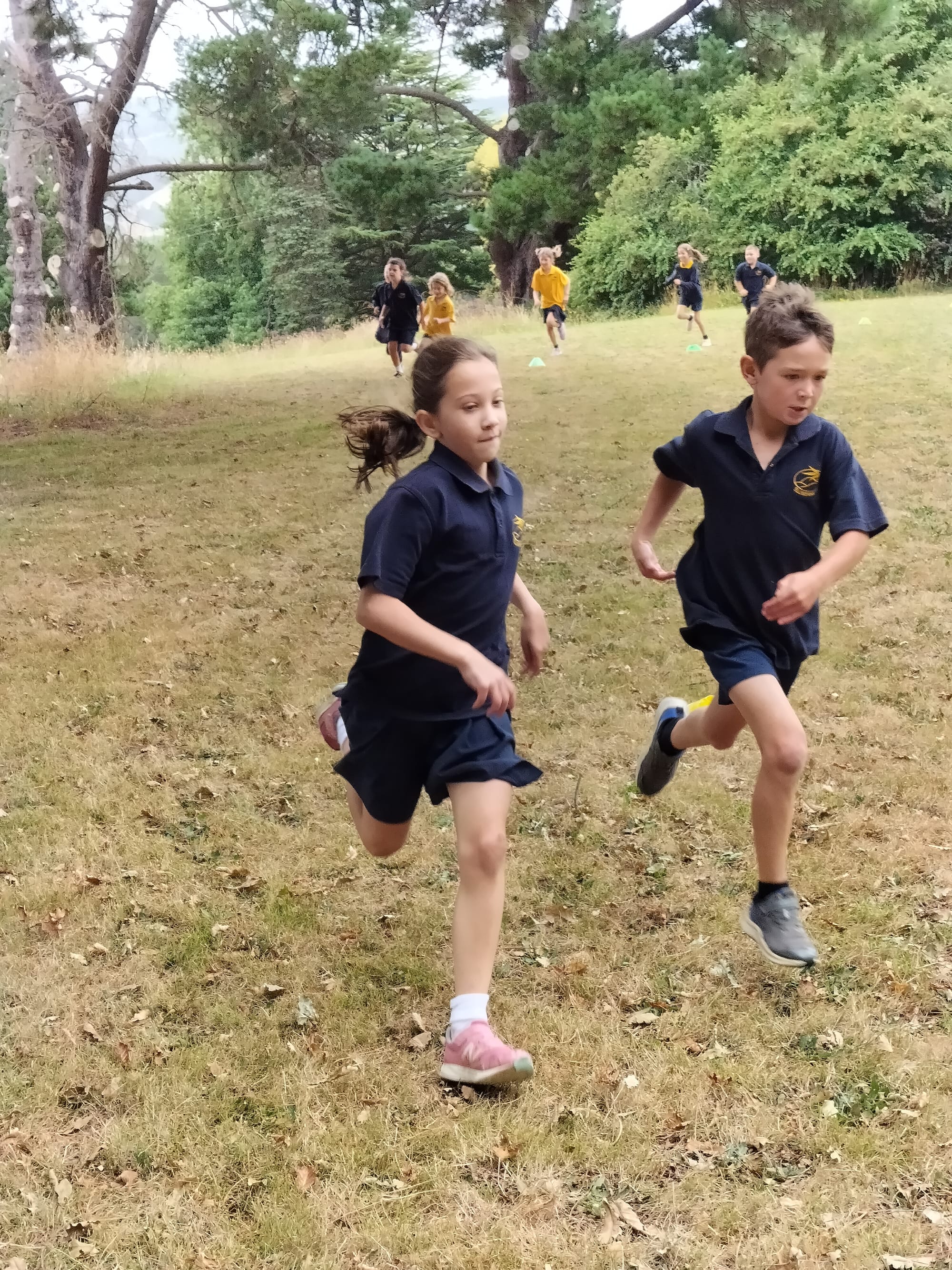 Willow Gonzalez and Max Mitchell sprint to finish the grade one and two 400 metre race.