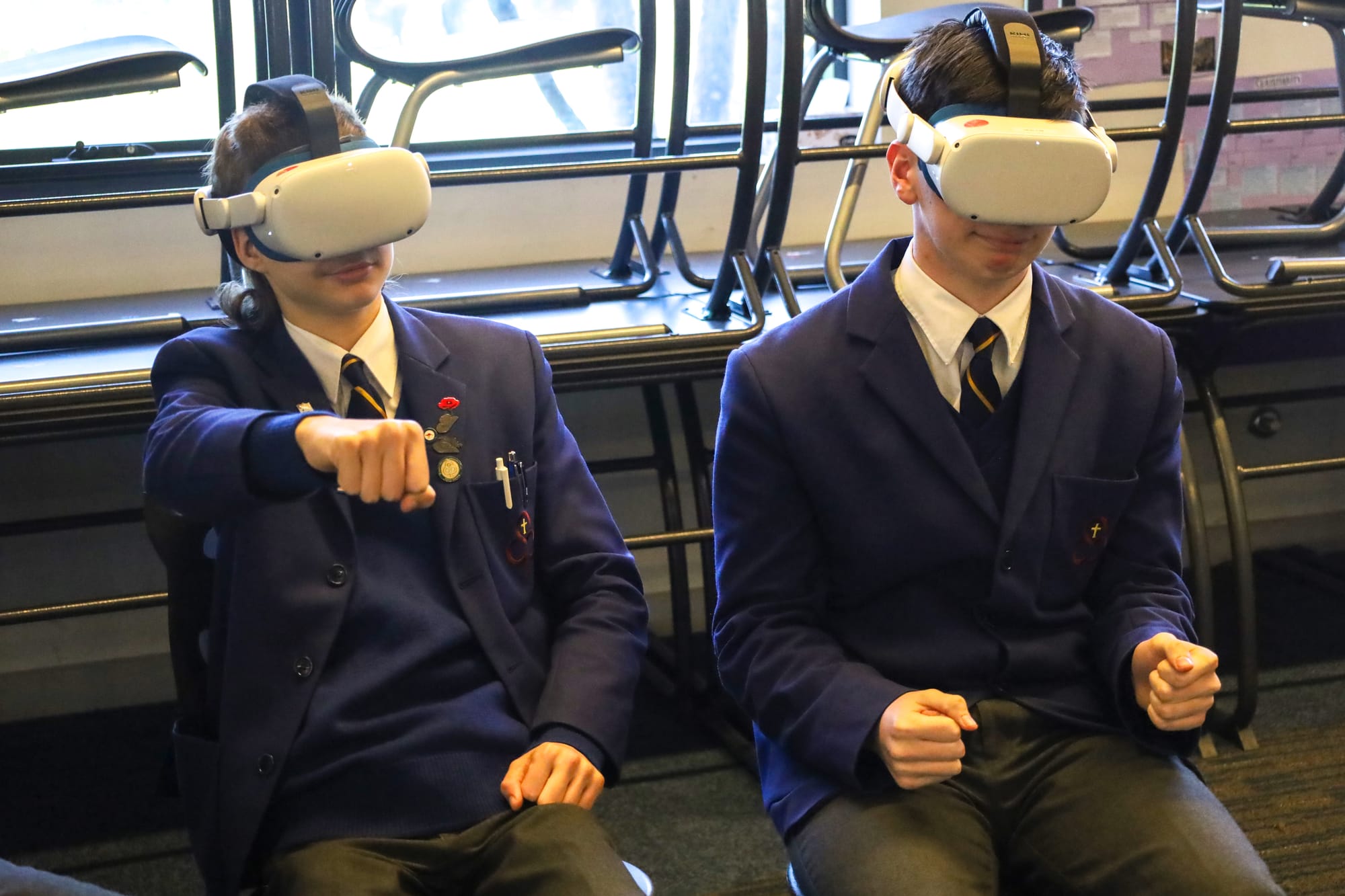 In a virtual reality simulation are St Paul's Anglican Grammar students James Gyorfi and Cooper Williams.