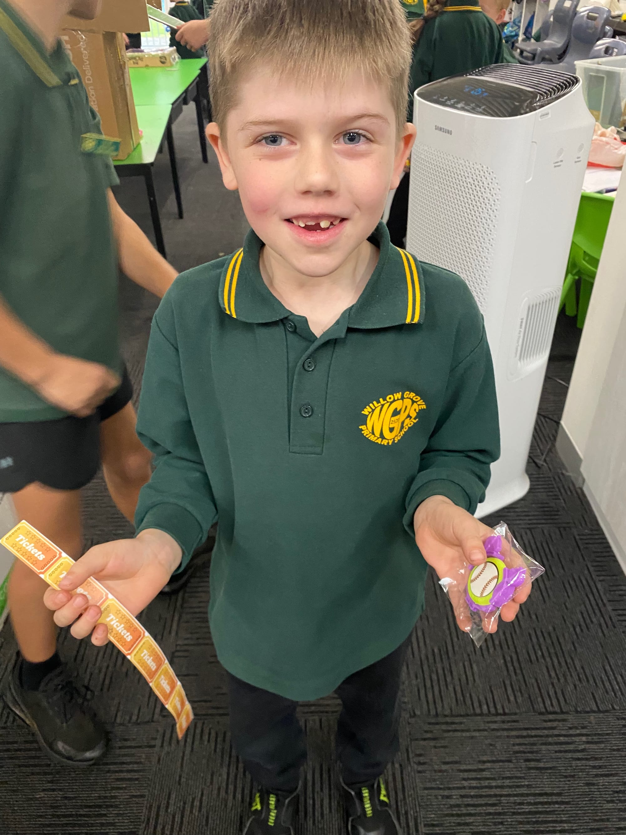 Jack showing off some of the prizes he won on the games