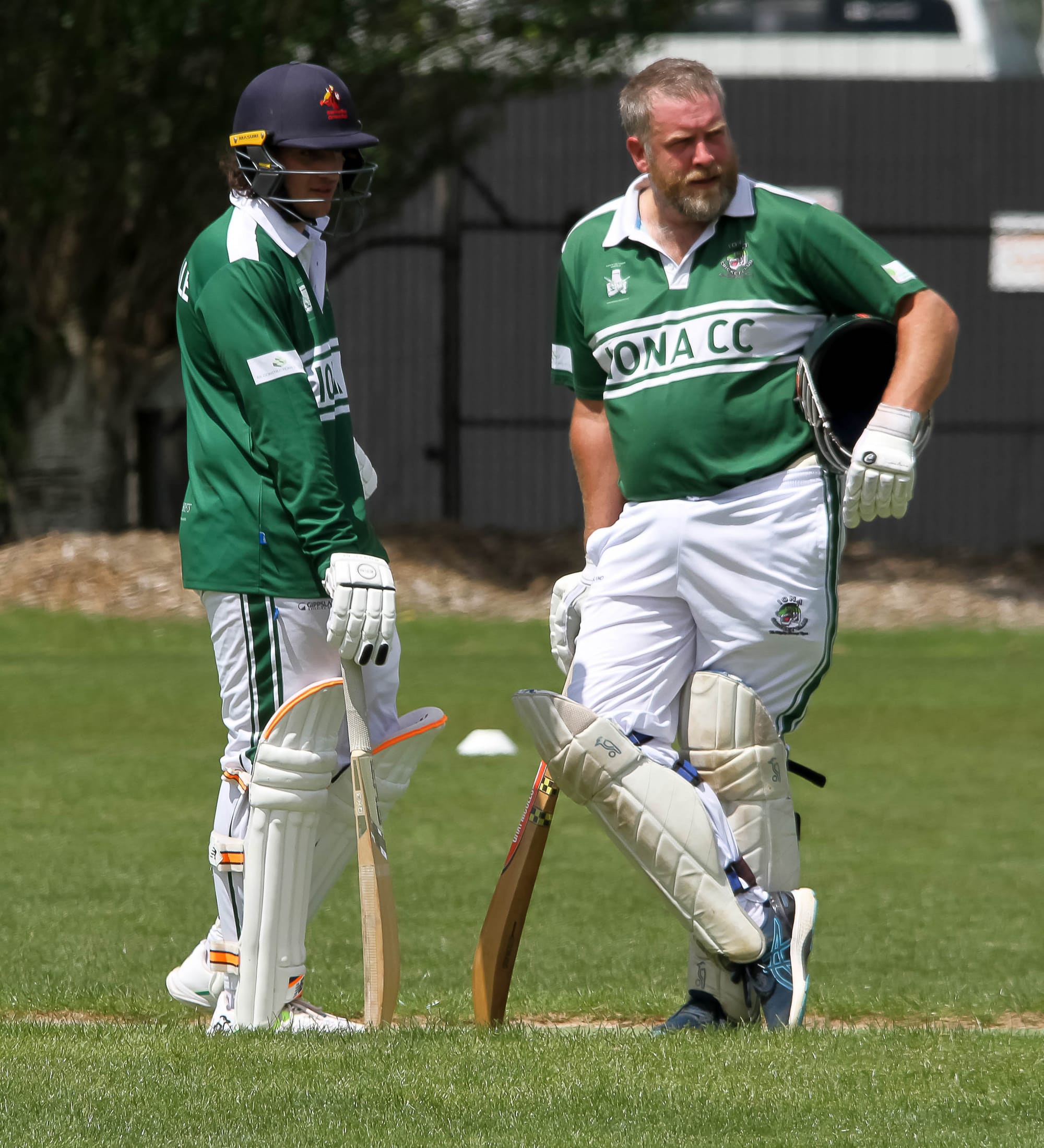 Iona's Jesse Depasquale and Michael Neilson talk batting tactics between overs. 