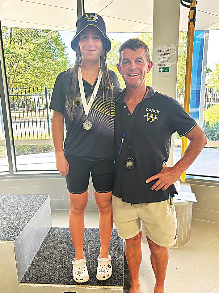 Left: Girls 13 to 14-year-old 100m breaststroke silver medalist Isabelle Nash with head coach Paul Myers.