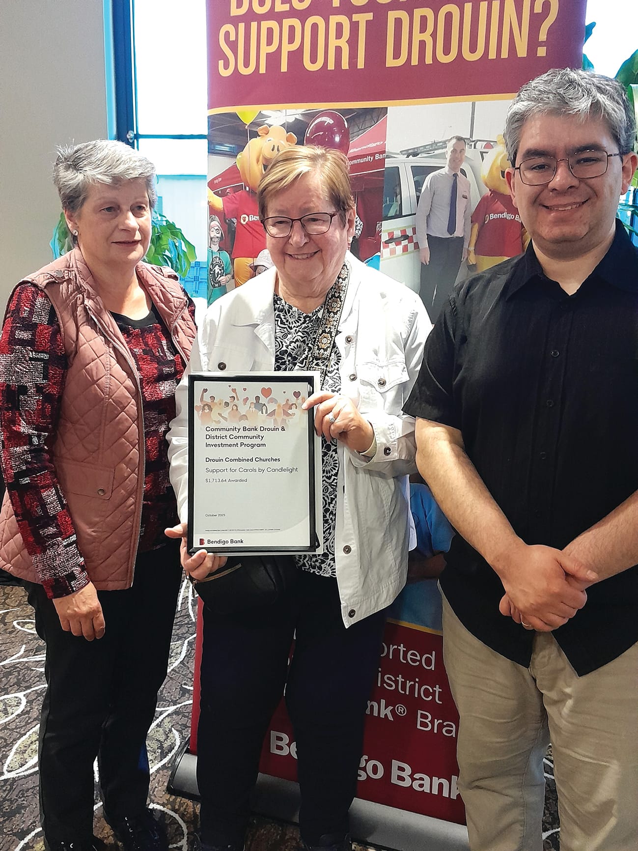 Drouin Combined Churches representatives Jenny Winterton and Barbara Durand thank director Rob Celada.