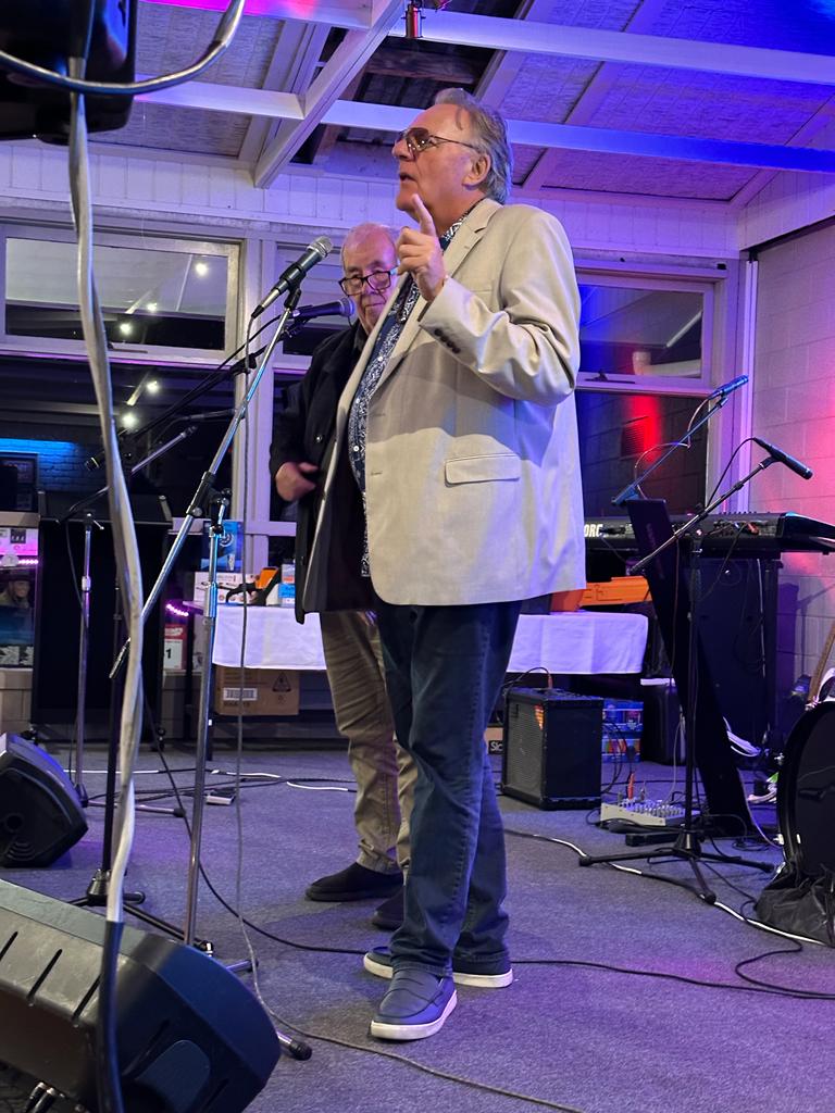 Well known musician Wilbur Wilde (foreground) and speaker and master of ceremonies Craig Willis lent their support to help raise $26,000 for local David Hobbs