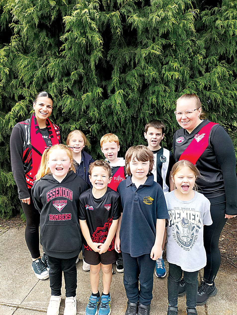 Right: The Ellinbank Primary School prep to grade two class show off their favourite team colours. they are (back, from left) Bree Monacella (education support), Grace Janssen, Angus Hodgson,Tate Oldham, teacher Emma Grigg, (front, from left) Olivia McPherson, Flynn Mitchell, Jack Foley and Madi Ashby.