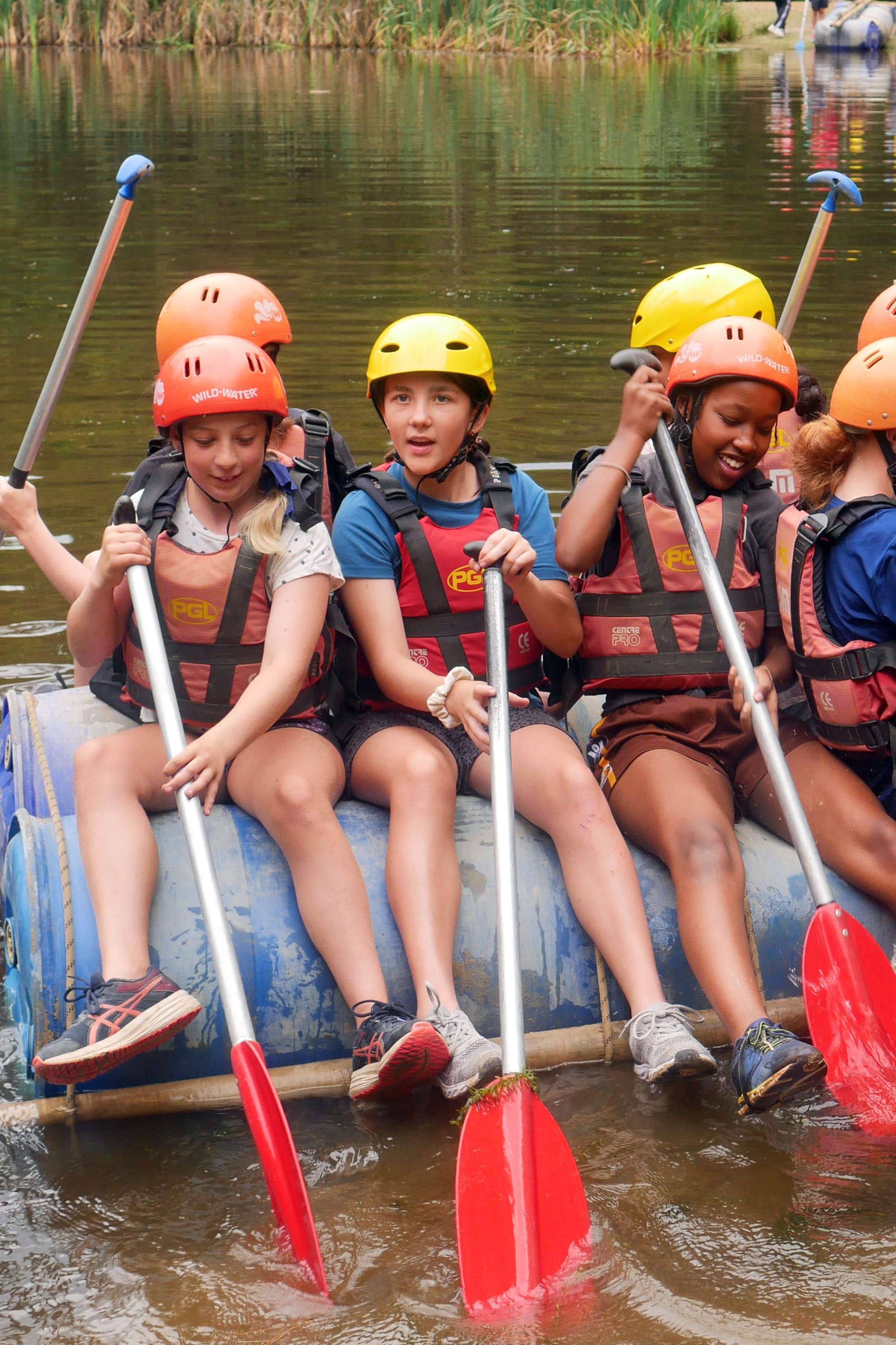 Keeping afloat on their teamwork-built raft are Lily Wilson, Addy McEwen and Rebecca Kesendany.