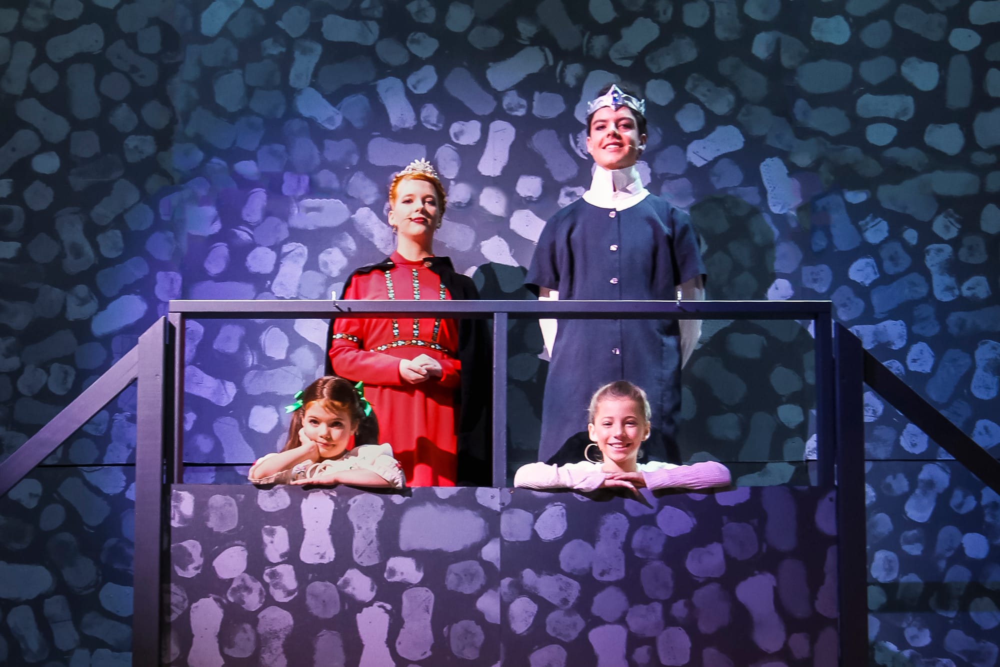 The King and Queen of Arendelle, Roy Barake and Inara Wilhelms stand proud over Arendelle with their young daughters Anna (Beatrice Wijgers) and Elsa (Bella Tully).
