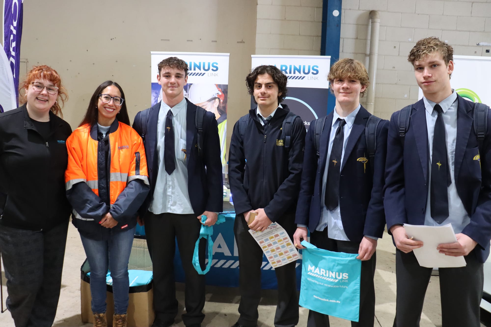 Holly Williams and Christina Young from renewable energy company Marinus Link, with Lavalla College students (from left) Tyler Lapenta, Lucas Carpino, Tane Kirk and Jake Zappulla.