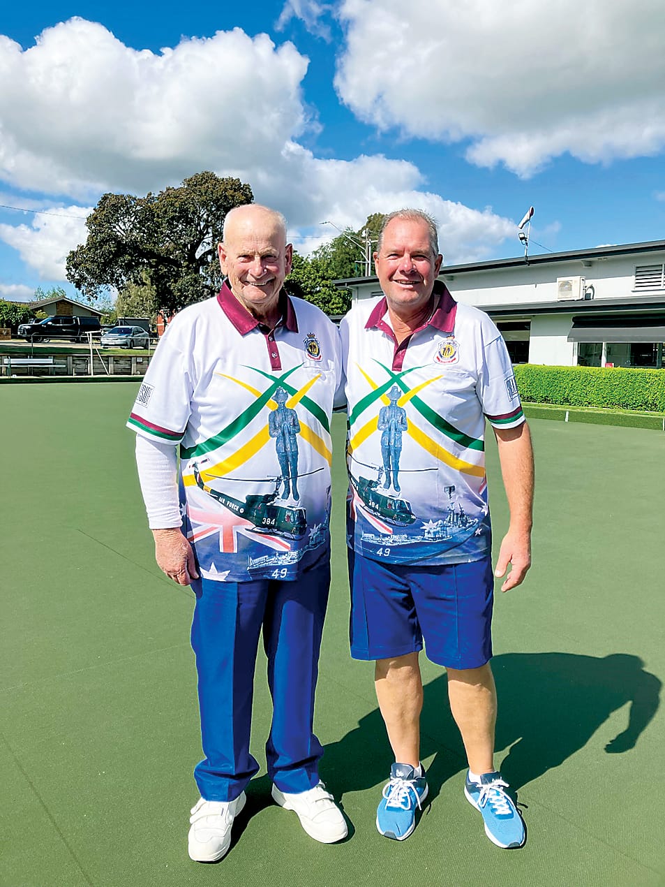 Colin Jeffrey (left) receives congratulations from runner-up Ian Wake after winning the Drouin/Warragul RSL singles championship.