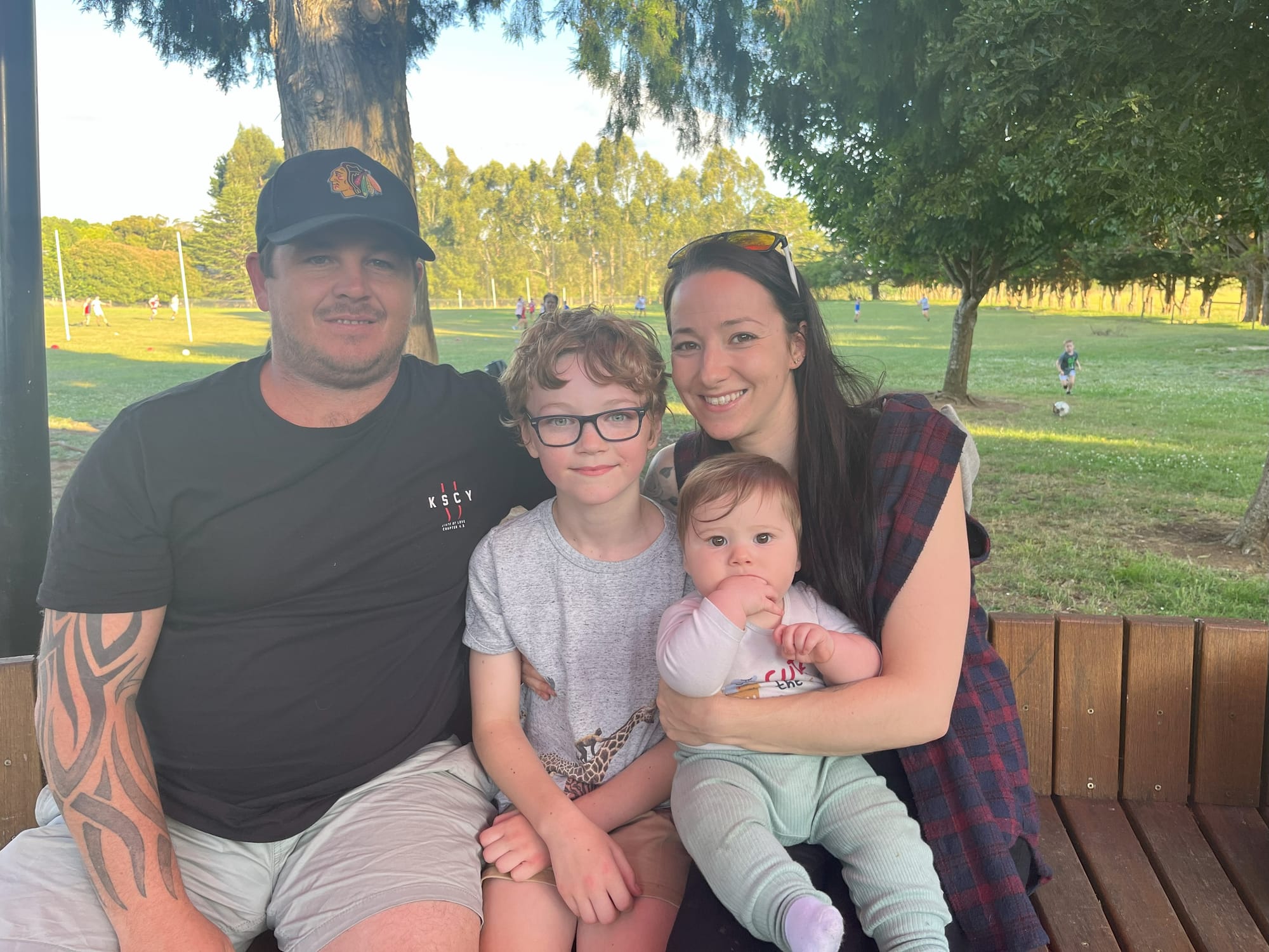 Grade four student Hayden Barber with his family Corey, Heather and Jax enjoy the barbecue together.