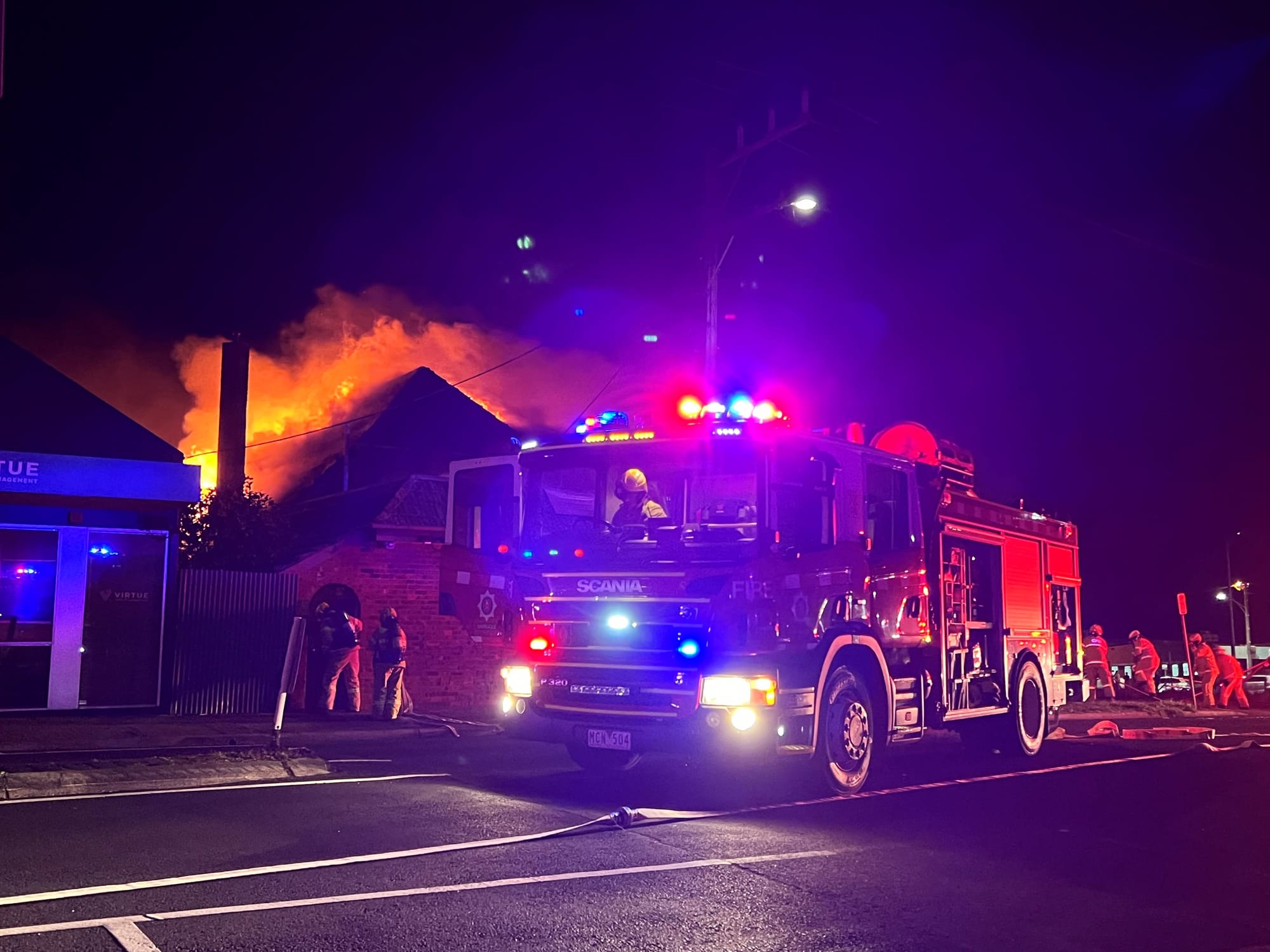 Firefighters battle fire in high winds