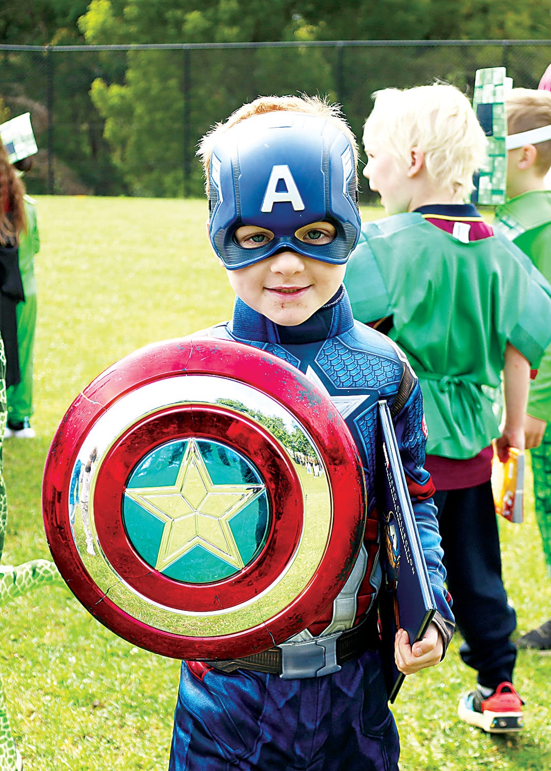 Above: Captain America, aka prep student Mack Jensz, enjoys the St Paul's book fair parade.Left: Fraser Leighton arrives at school in a very stylish pilot uniform for book fair celebrations.